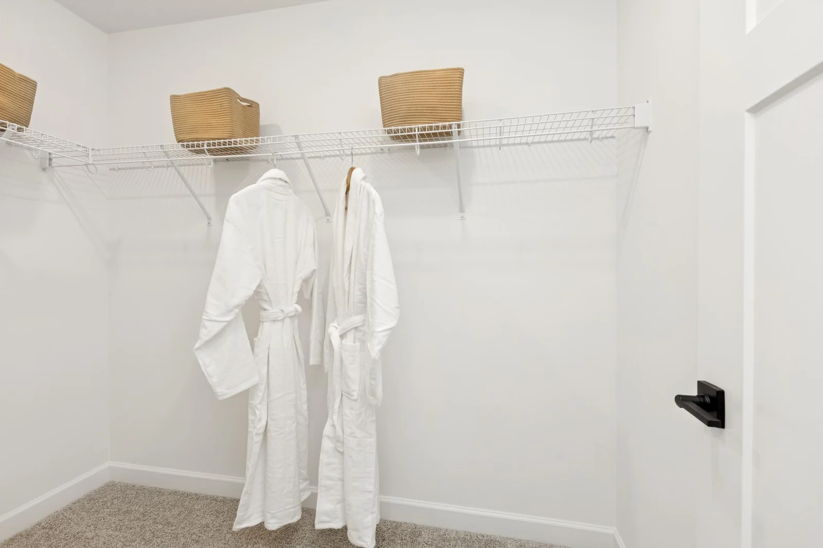(Photo of a decorated model home, features and finishings will vary) The owner's closet!