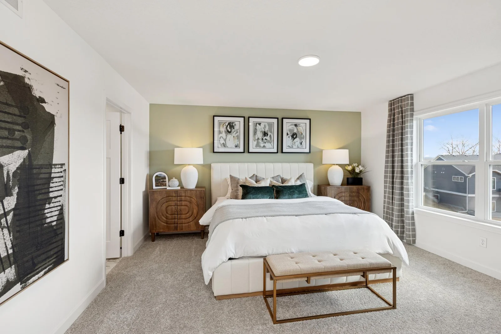 (Photo of a decorated model home, features and finishings will vary) The Owner's Suite!