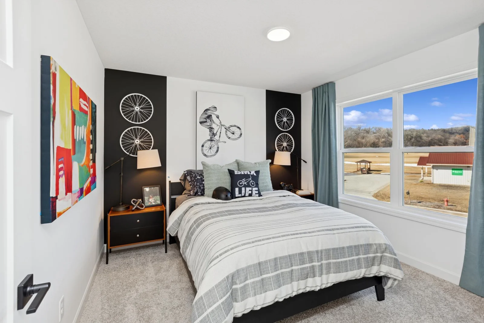 (Photo of a decorated model home, features and finishings will vary) One of the spacious secondary bedrooms.