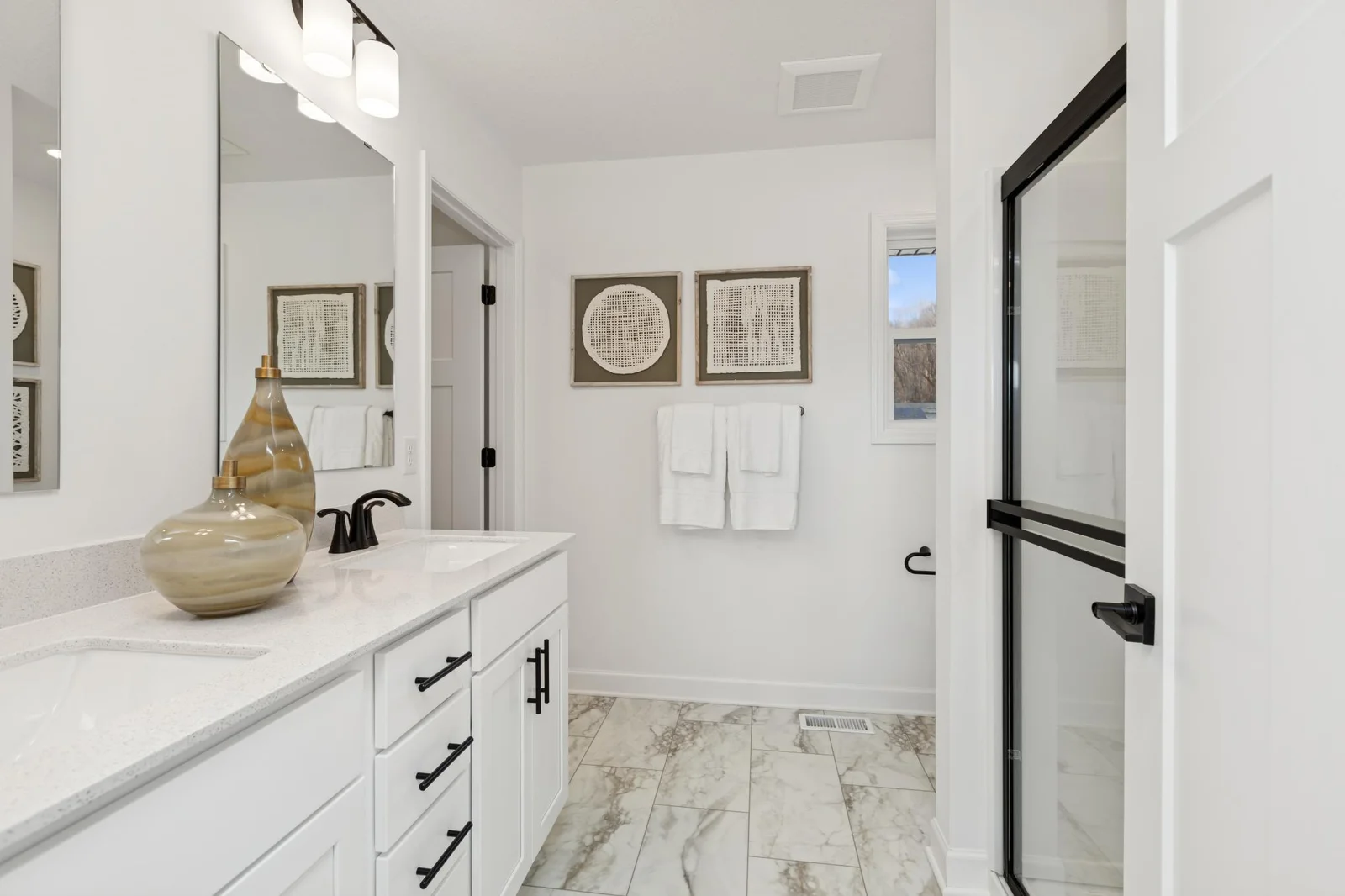 (Photo of a decorated model home, features and finishings will vary) Double sinks and a step-in shower!