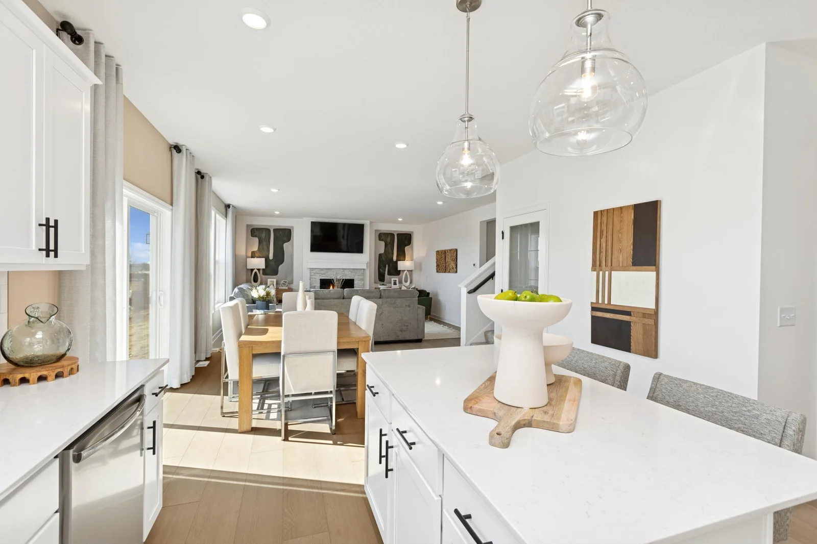 (Photo of a decorated model home, features and finishings will vary) A view of the open-concept kitchen, dining, and Great room.