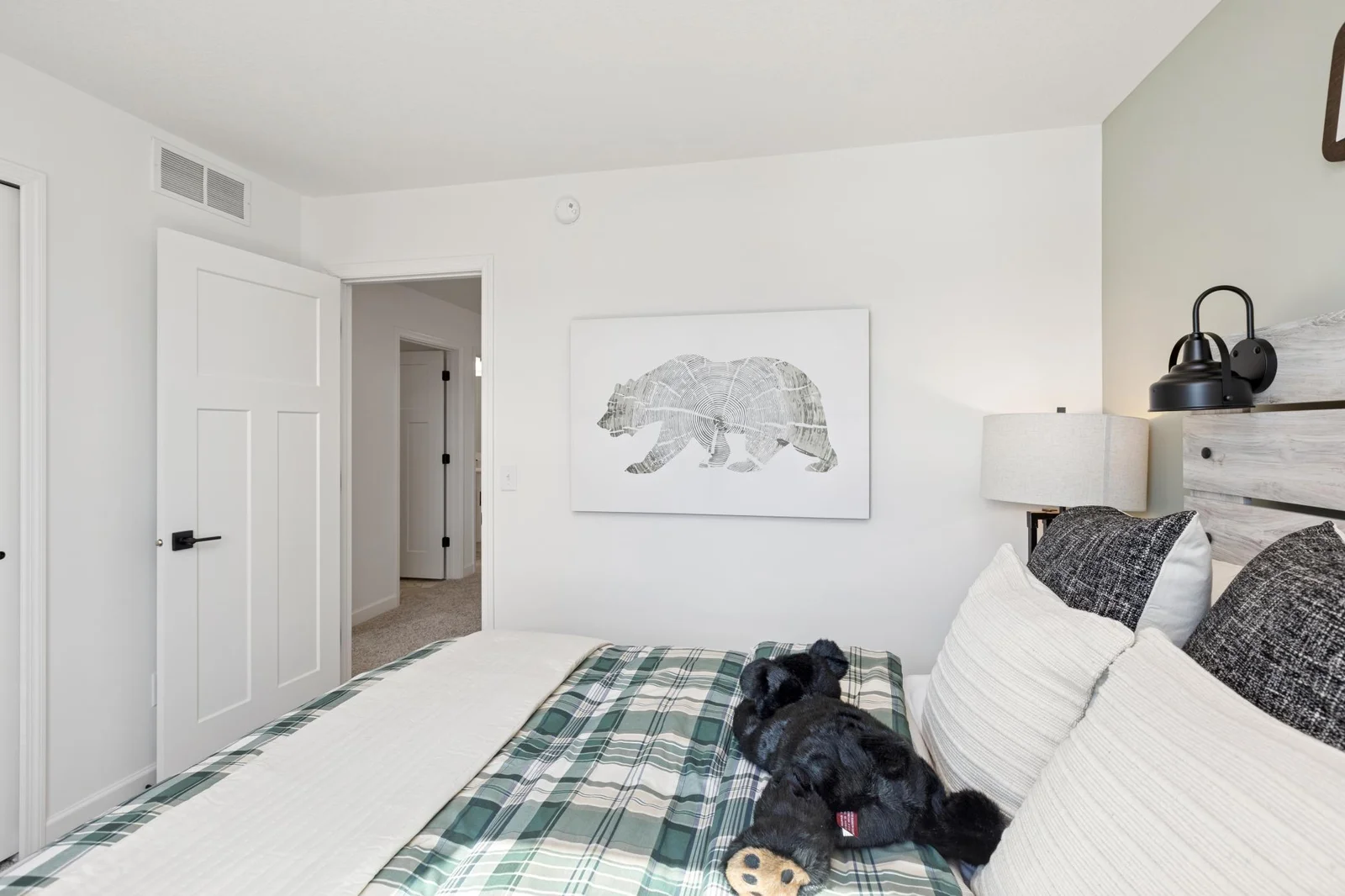 (Photo of a decorated model home, features and finishings will vary) One of the spacious secondary bedrooms.