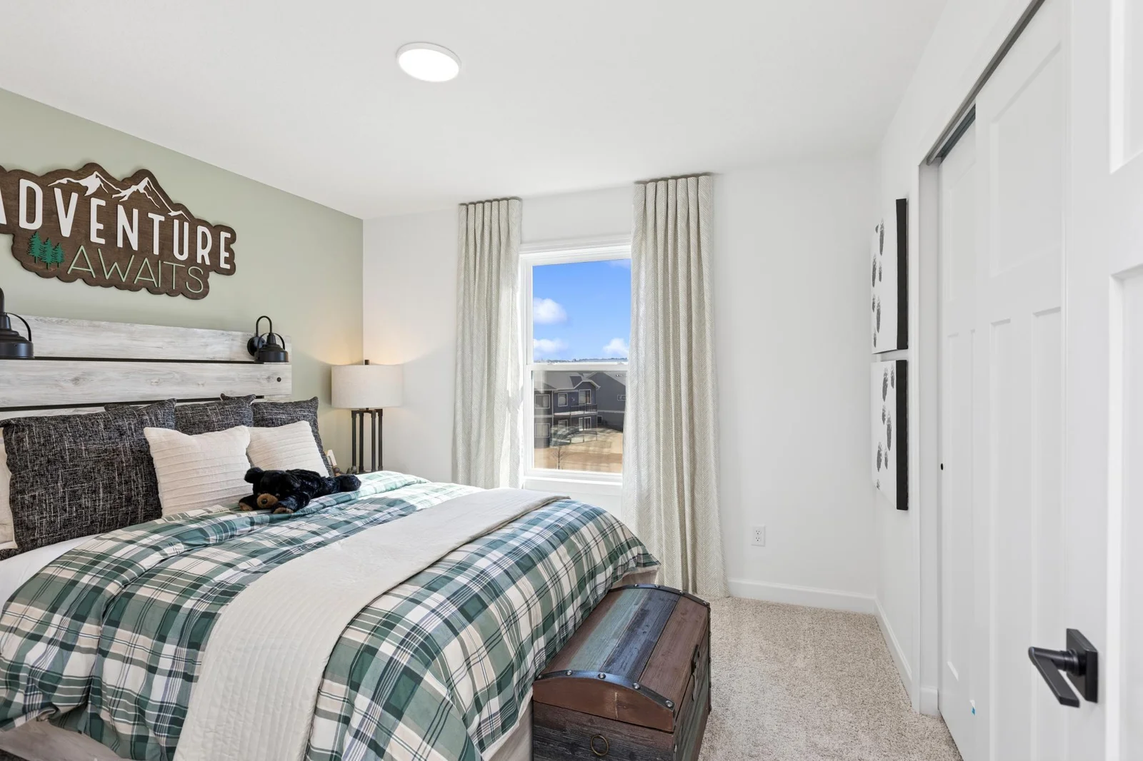 (Photo of a decorated model home, features and finishings will vary) One of the spacious secondary bedrooms.