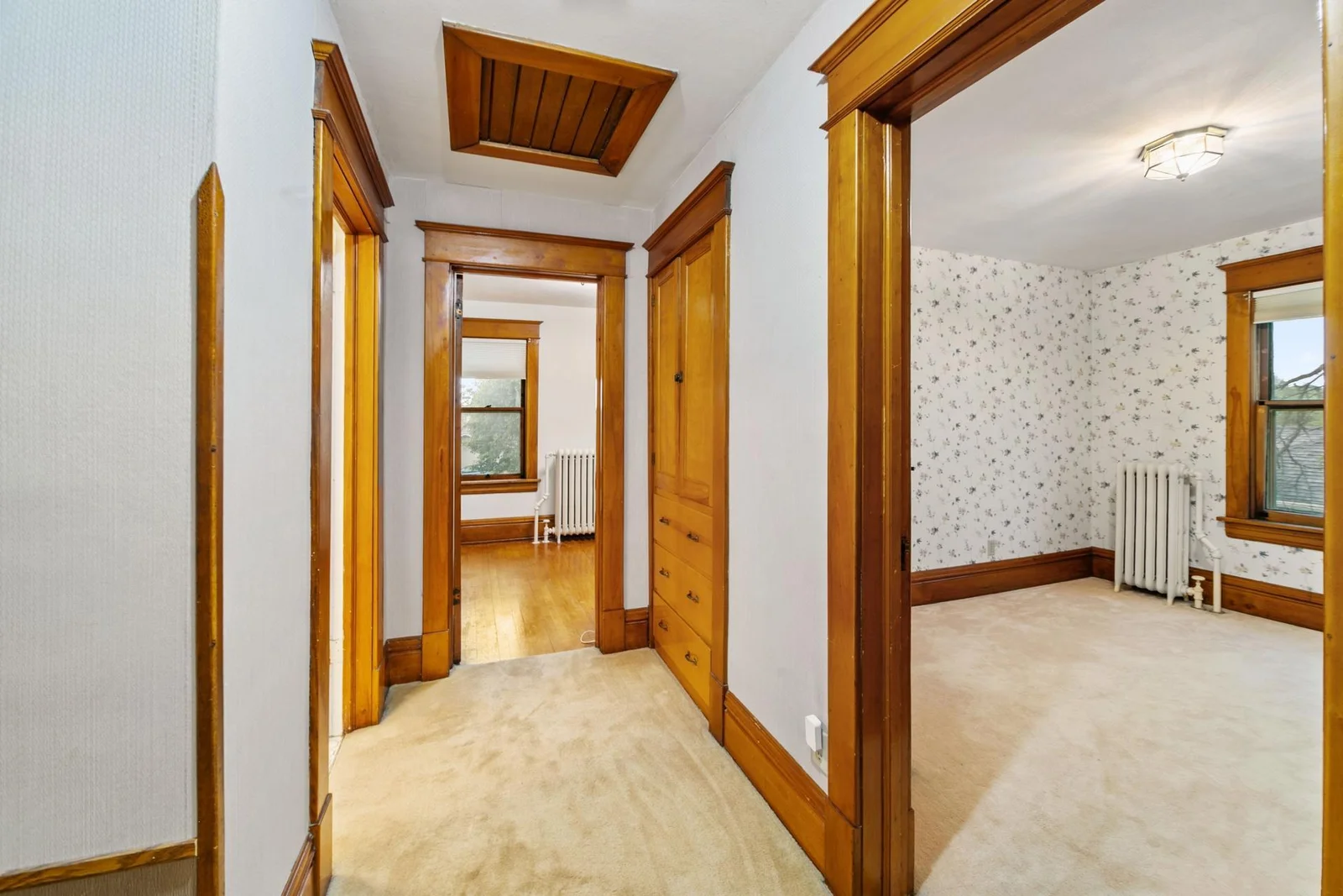 Upper level hallway with built-in cabinets and drawers