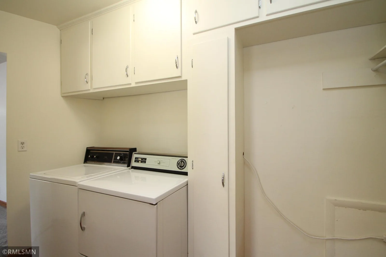 Laundry room with nice cabinetry.  On the main floor!