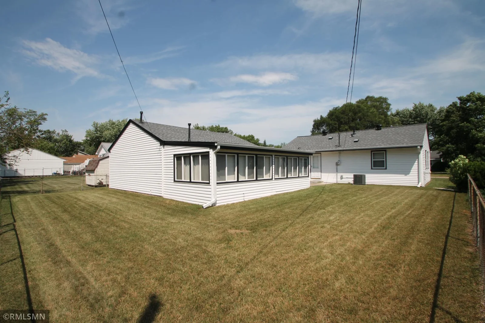 Spacious back yard is fenced.