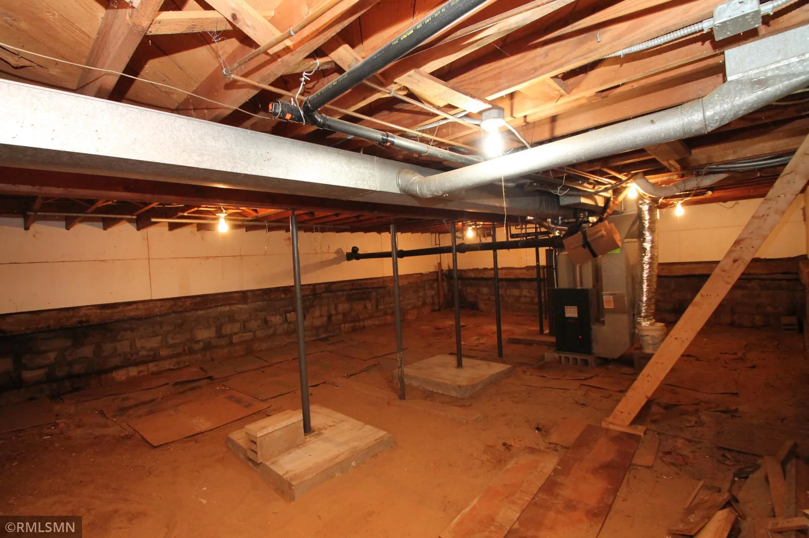 Lower level has higher ceilings than a typical crawl space.  Newer furnace and water heater.