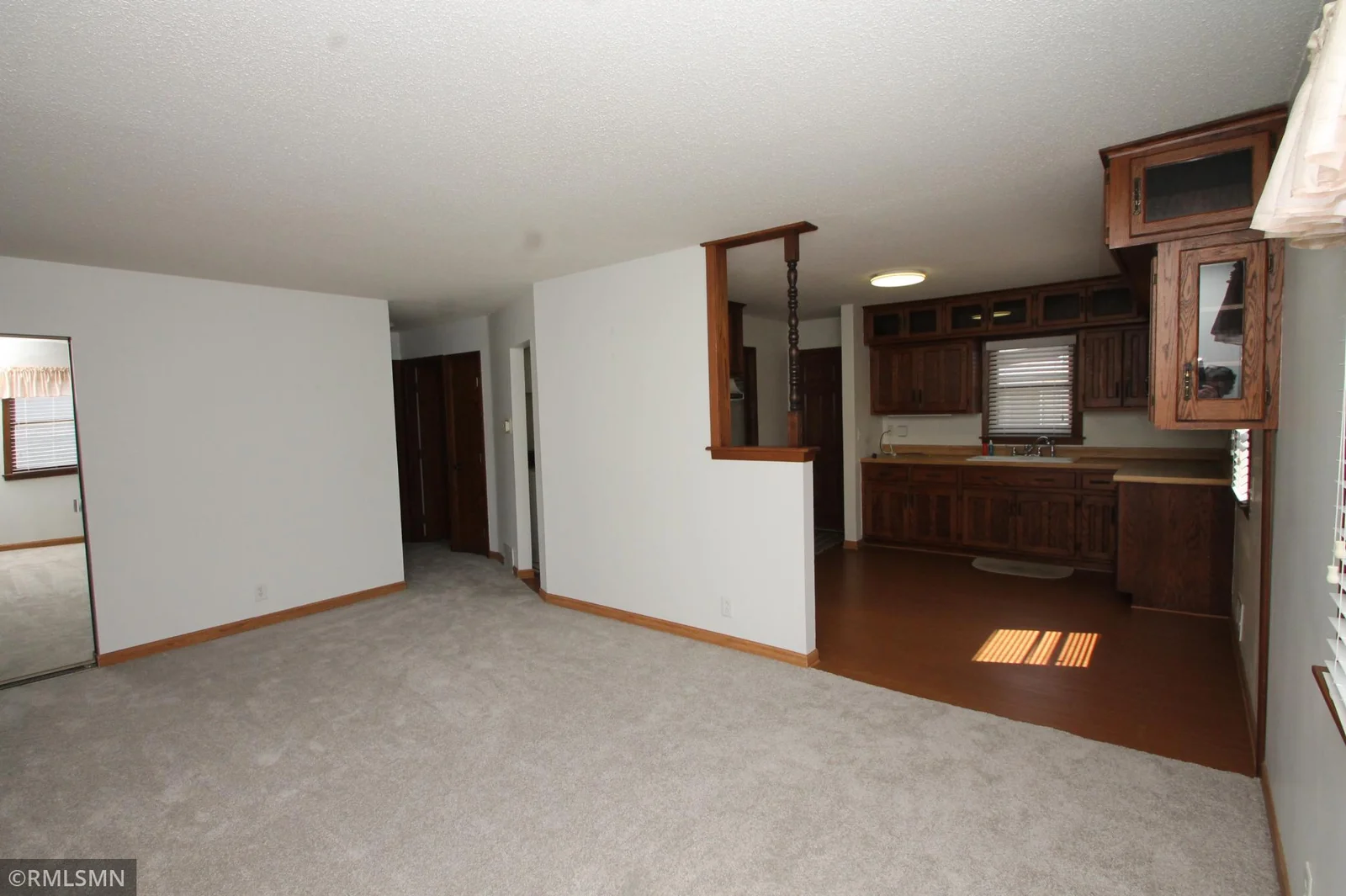 Living room with brand new carpet.  Both bedrooms also.