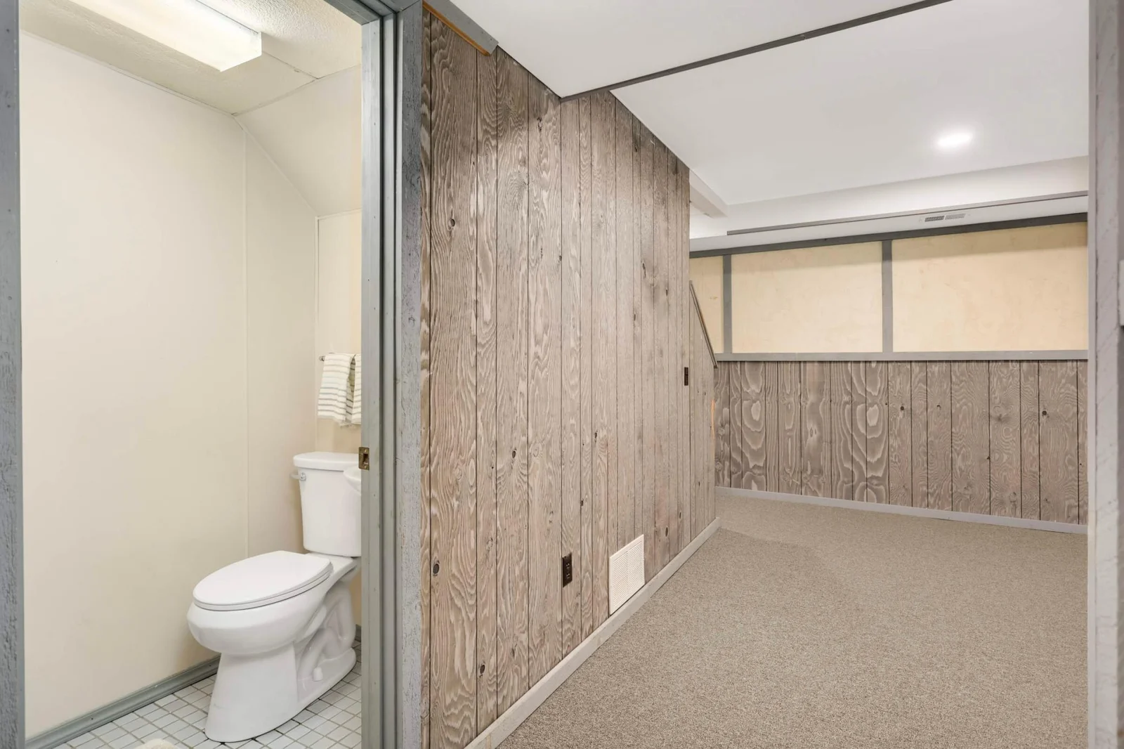 1/2 bath off lower level amusement room