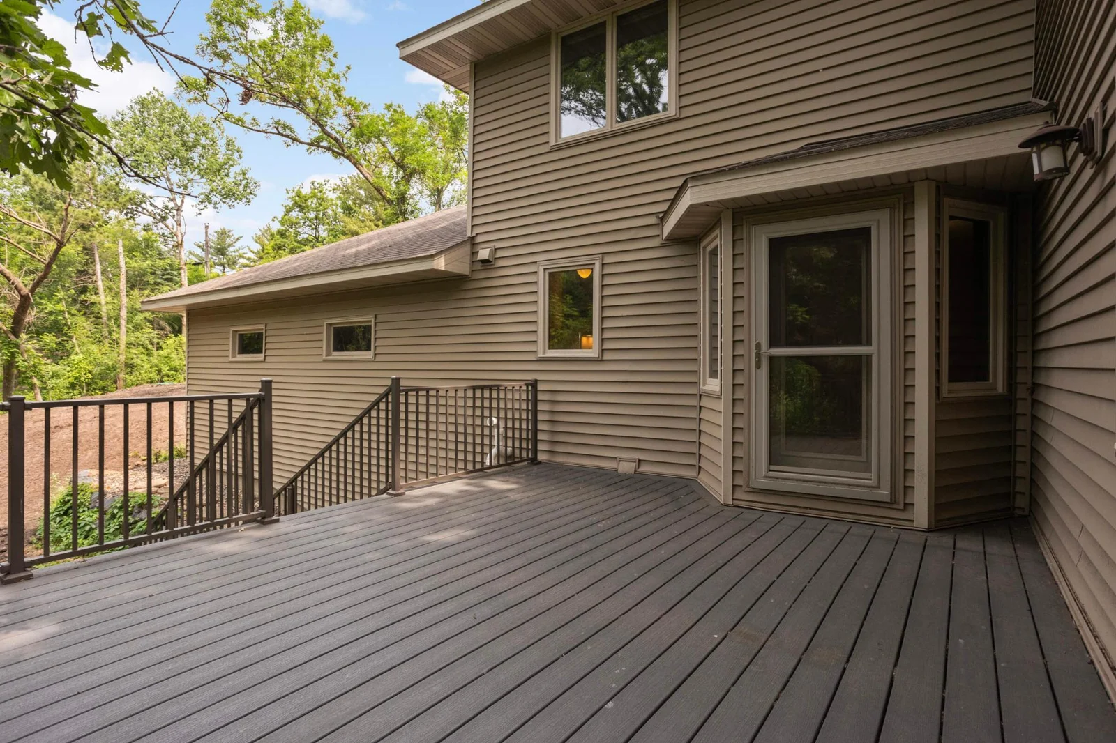 Back deck with stariway to back and side yards