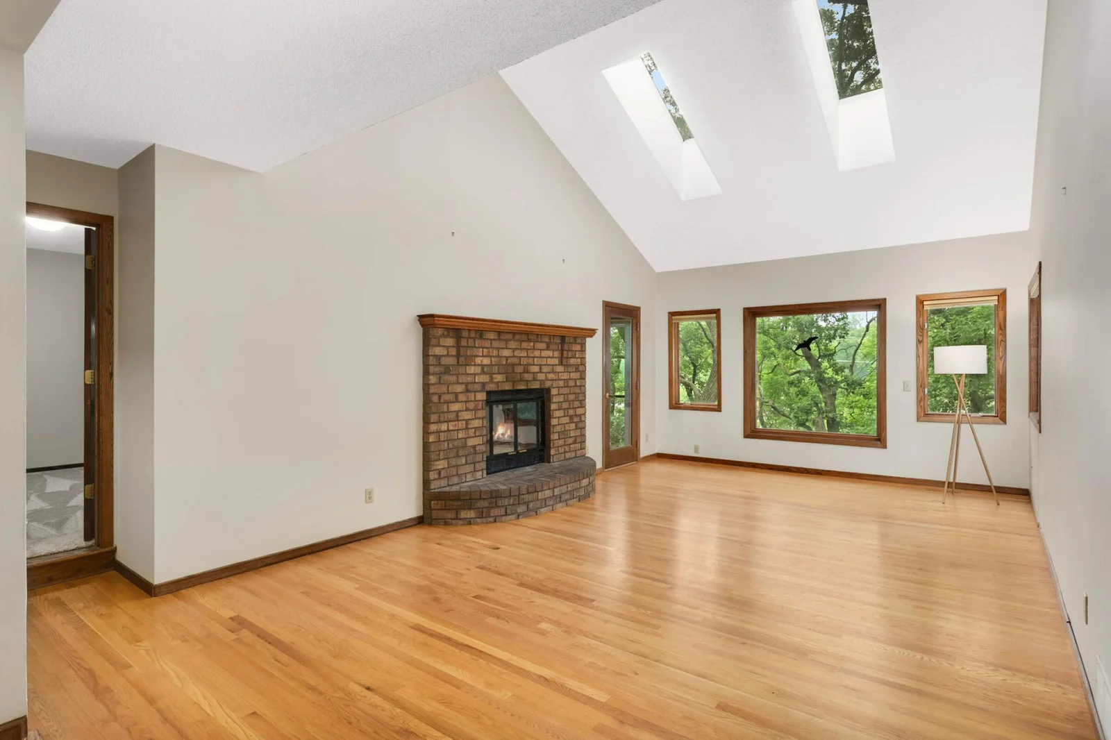 Door to right of fireplace leads to screen porch