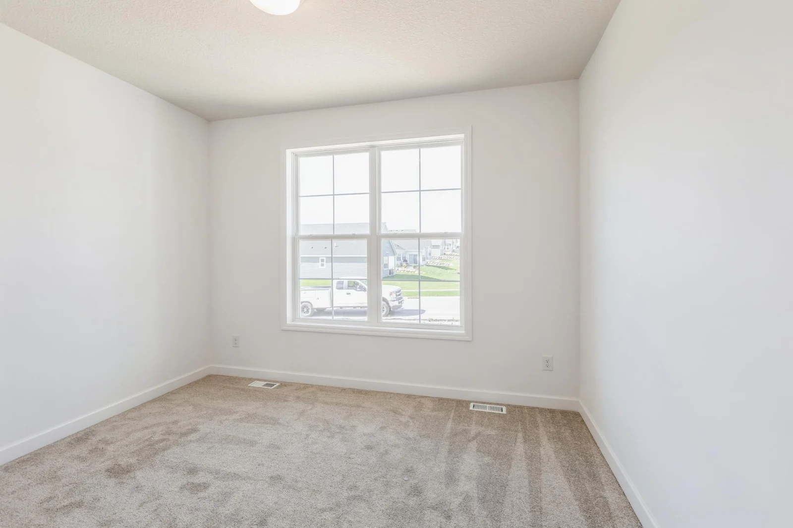 (Photo of similar home, features will vary) At the front of the home is a bedroom to accommodate visiting guests or make an at home office!