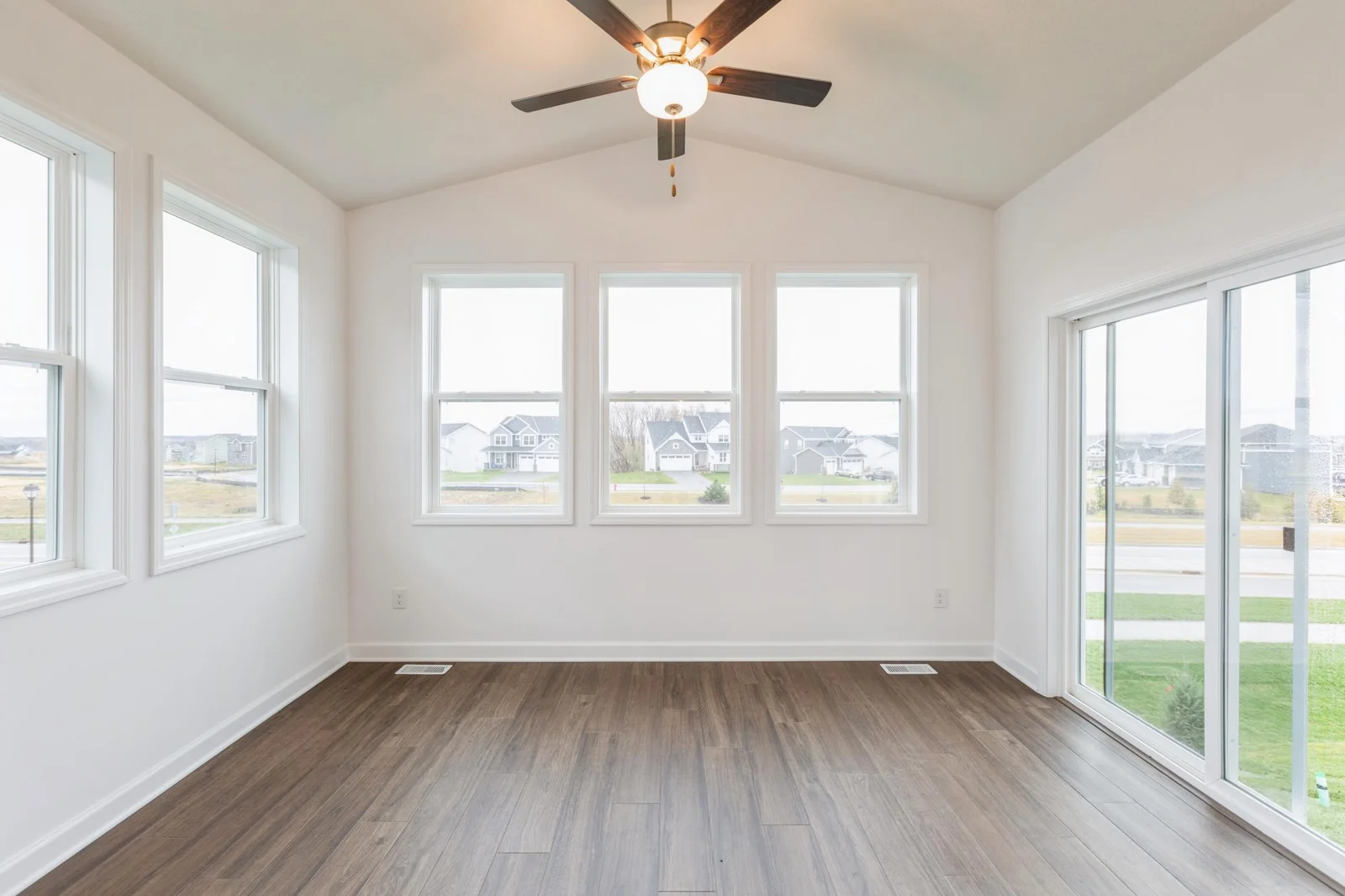 (Photo of similar home, features will vary) The four-season porch.