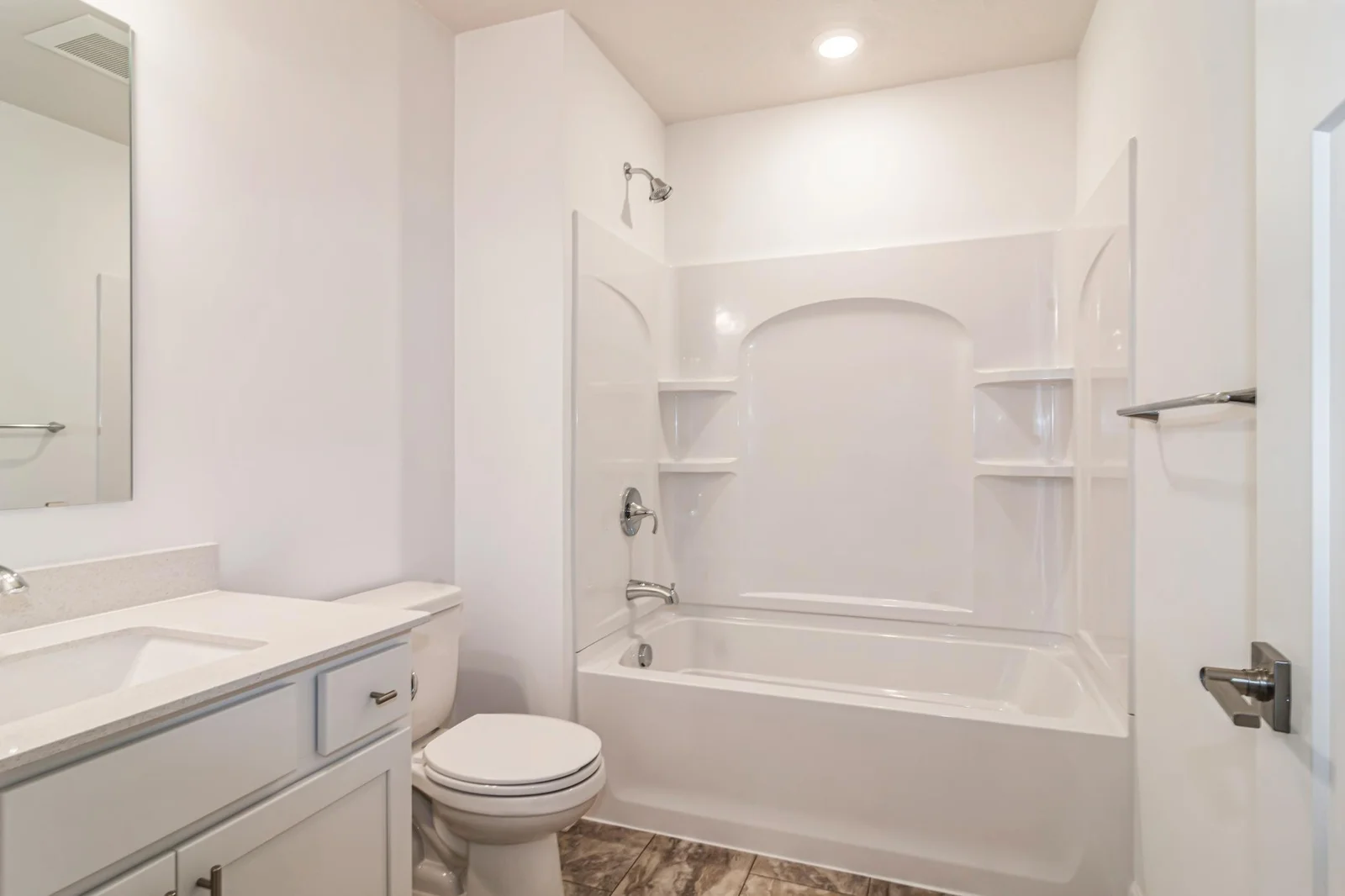 (Photo of similar home, features will vary) The lower level bath.