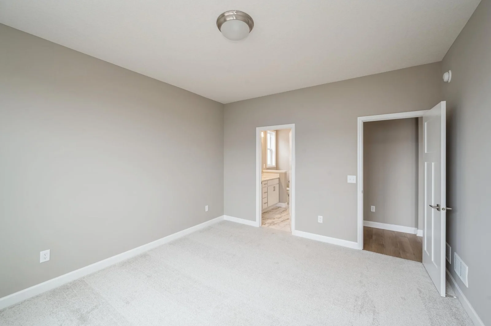 (Photo of similar home, features will vary) The spacious owner's suite is large enough for a king-sized bed and accessories.