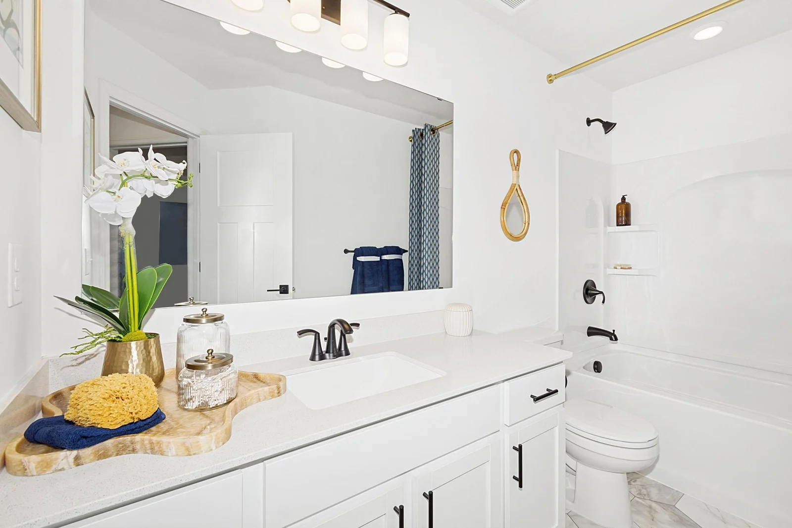 (Photo of a decorated model, actual homes finishes will vary) Spacious full secondary bath provides plenty of space for everyone to get ready during those busy mornings.
