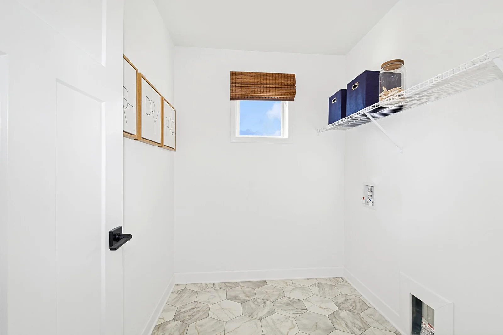 (Photo of a decorated model, actual homes finishes will vary) Fantastic upper level laundry!