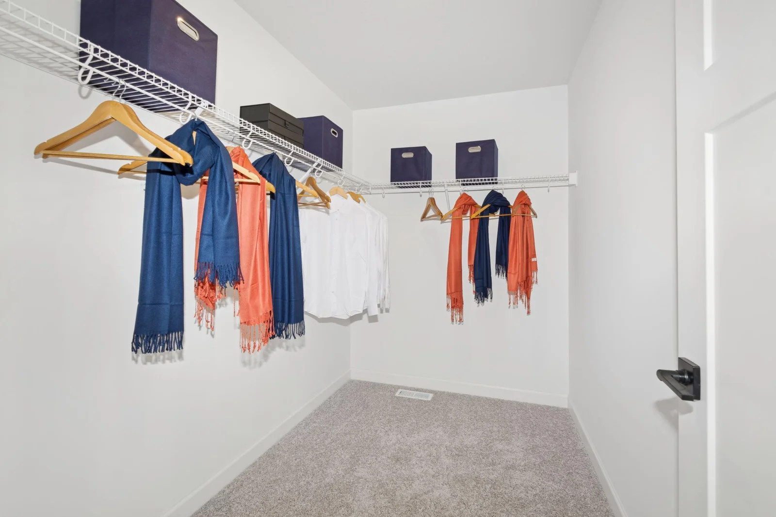 (Photo of decorated model, actual home finishes will vary) The primary bedroom features an incredible walk-in closet.