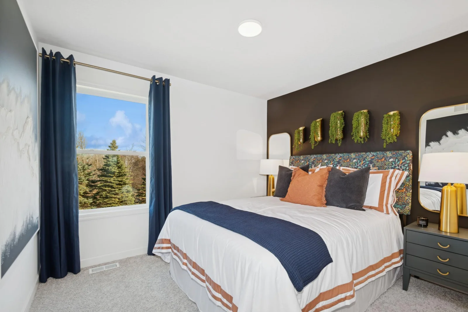 (Photo of a decorated model, actual homes finishes will vary) The upper level has 3 spacious secondary bedrooms!