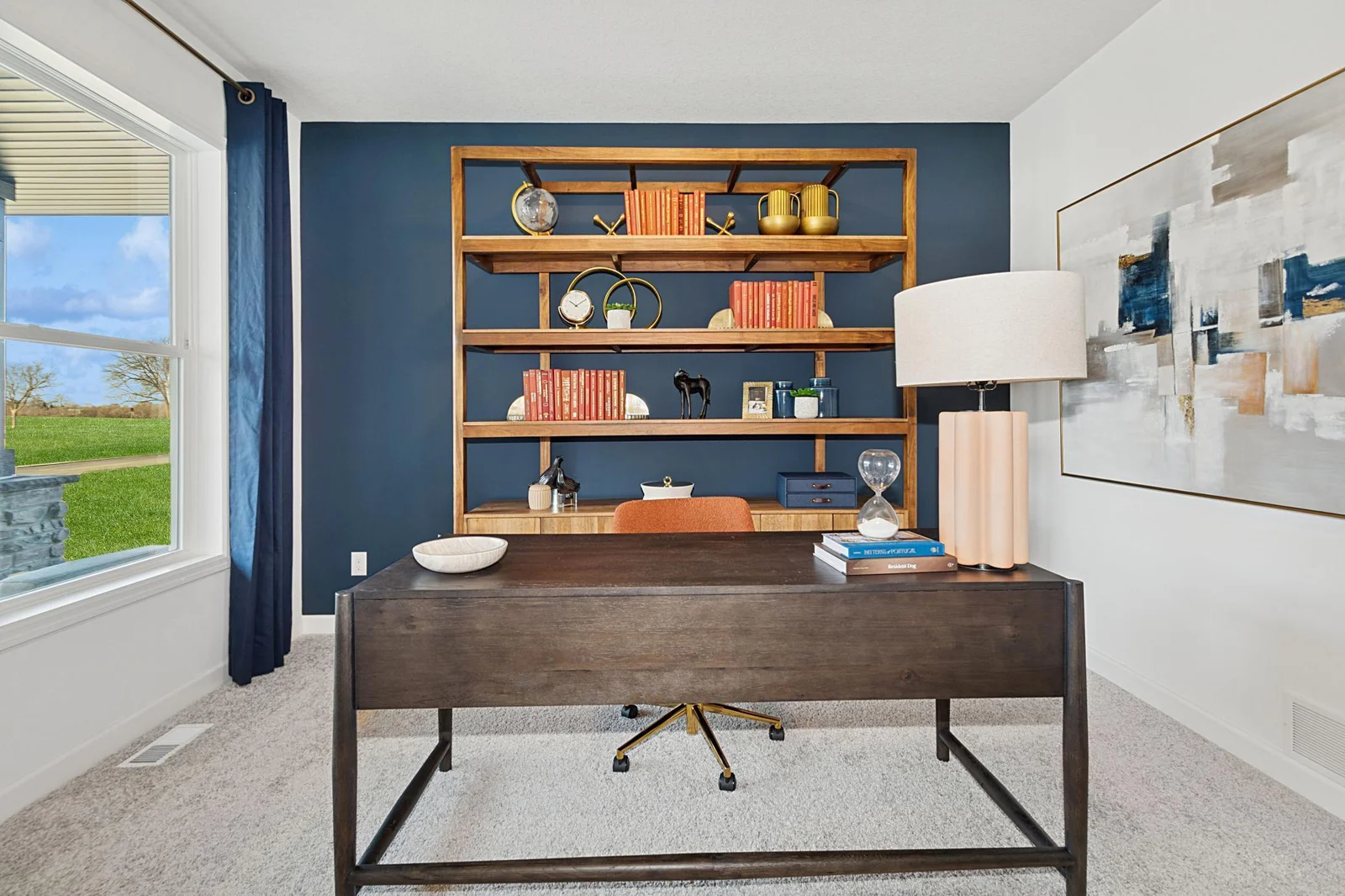 (Photo of a decorated model, actual homes finishes will vary) This main level study provides the perfect setting for those working from home, paying bills or completing a school project.