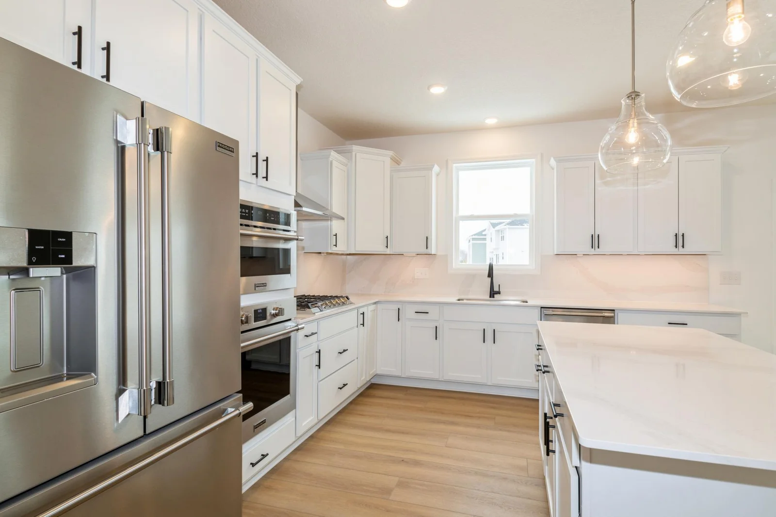 (Photo of a decorated model, actual homes finishes will vary) Another view of the gourmet kitchen.