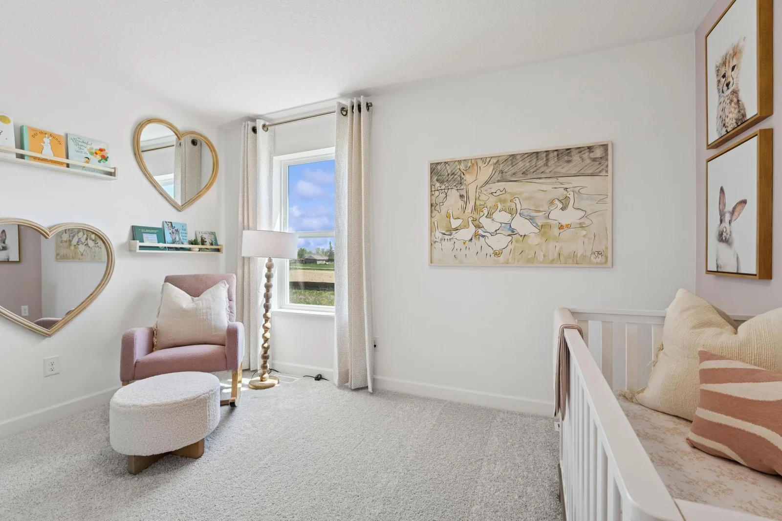 (Photo of a decorated model. Features and finishes will vary) One of the spacious secondary bedrooms.