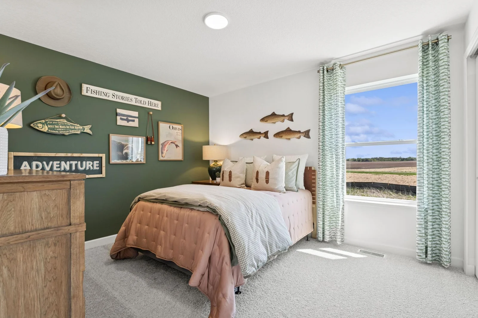 (Photo of a decorated model. Features and finishes will vary) One of the spacious secondary bedrooms.