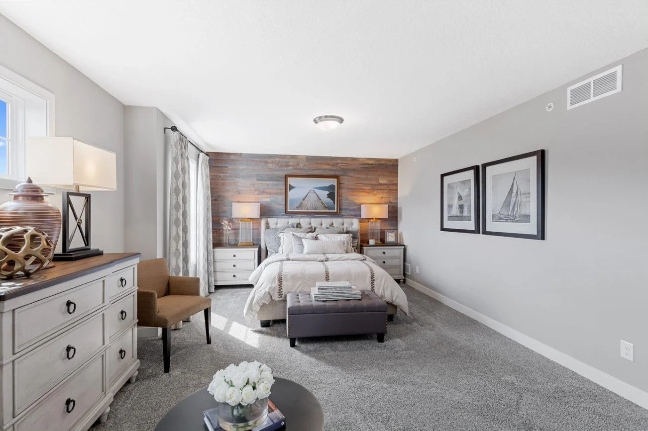 (Photo of a decorated model, actual homes finishes will vary) Spacious, imaginative and modern would best describe the owner's suite.
