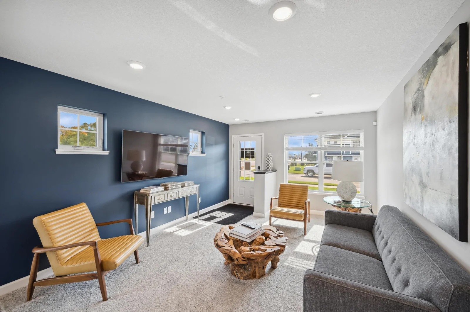 (Photo of decorated model, actual home's finishes vary) Notice the stunning natural light pouring into the family room.