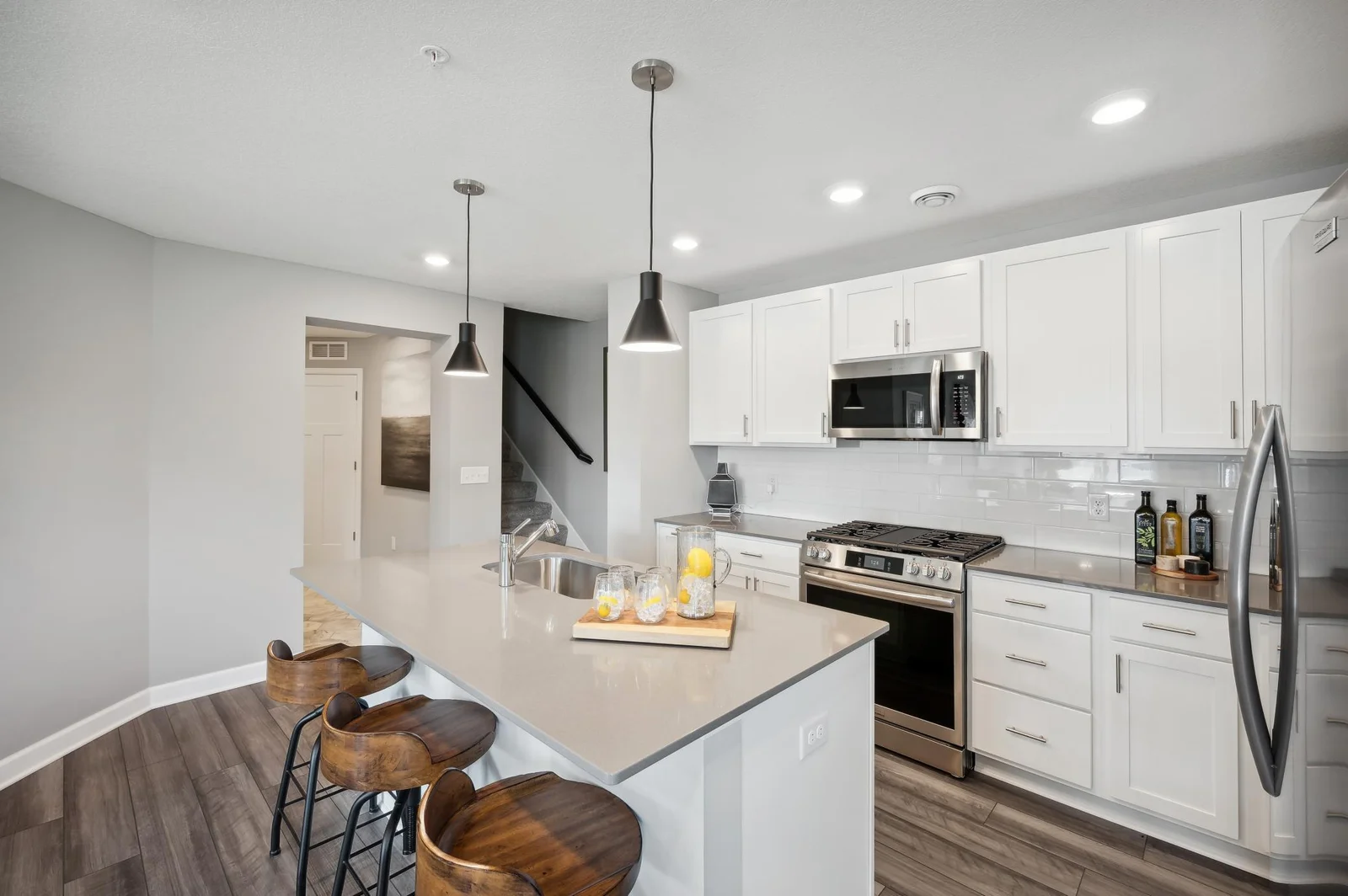 (Photo of a decorated model, actual homes finishes will vary)  (Photo of decorated model, actual home's finishes vary) Thoughtfully-designed with a combination of functionality and modern design, this kitchen space is sure to impress.