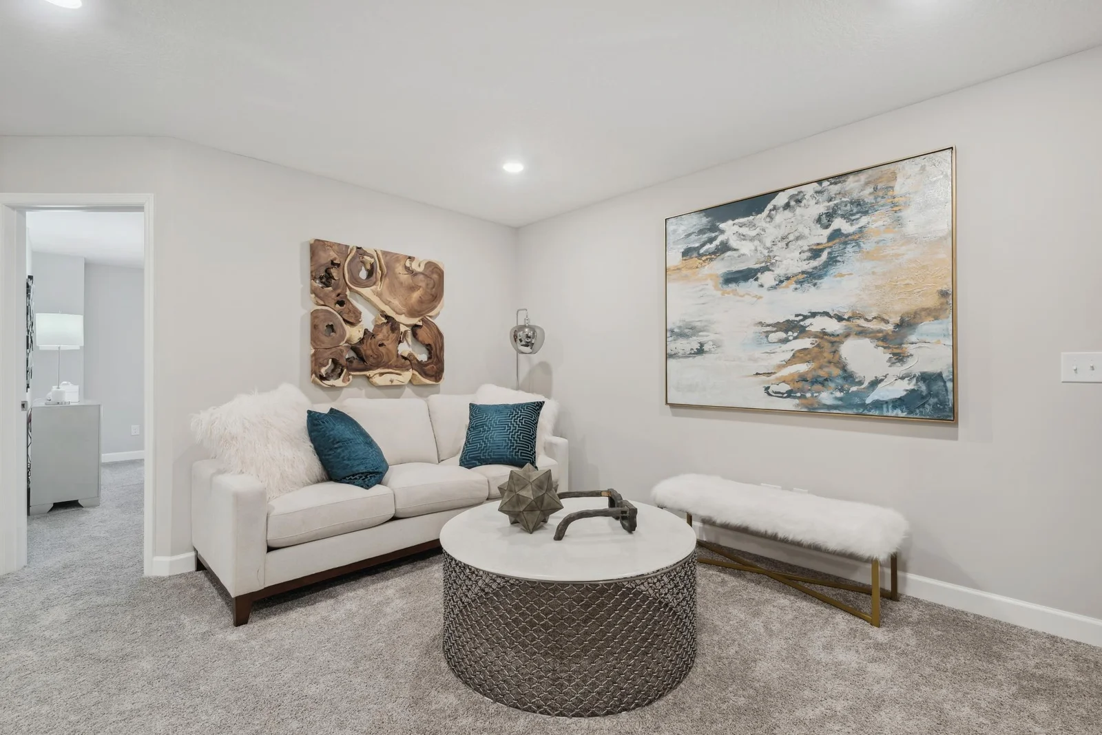 (Photo of a decorated model, actual homes finishes will vary) Located on the upper level, this perfectly sized living space has enough room for a desk, television and seating for all. Plus, it is just steps away from the three bedrooms.