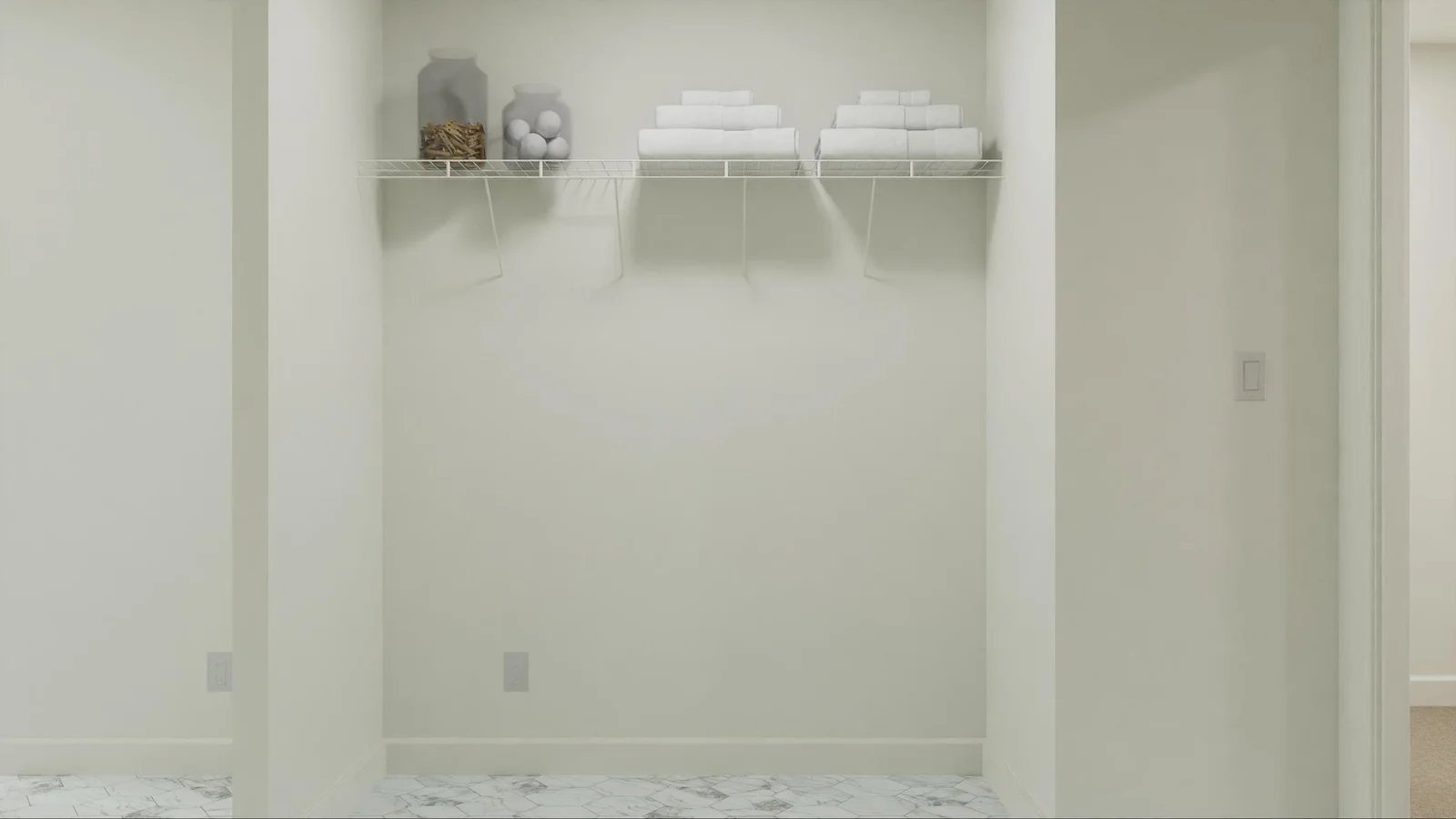 (Photo is of a virtual rendering, actual finishes will vary) The laundry room includes an overhead shelf and washer-dryer hookups to ease busy chore days.