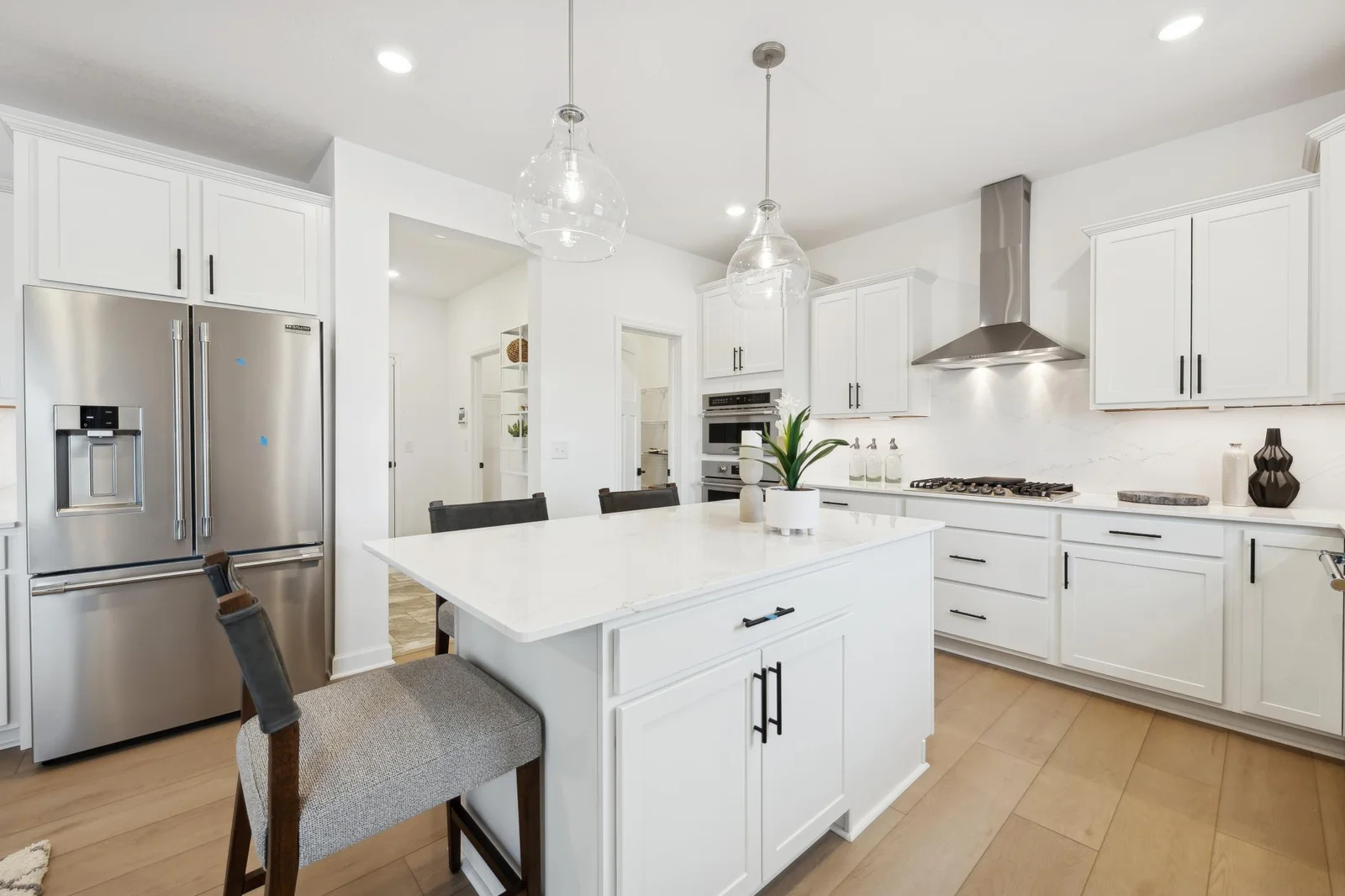 (Photos of model home, features will vary) The gourmet kitchen has ease-of-access to the mudroom and flows seamlessly into the dining room