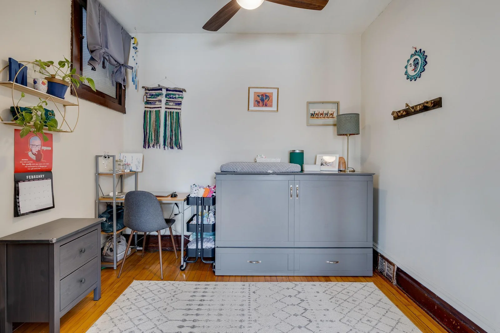 Well sized bedroom with a ceiling fan
