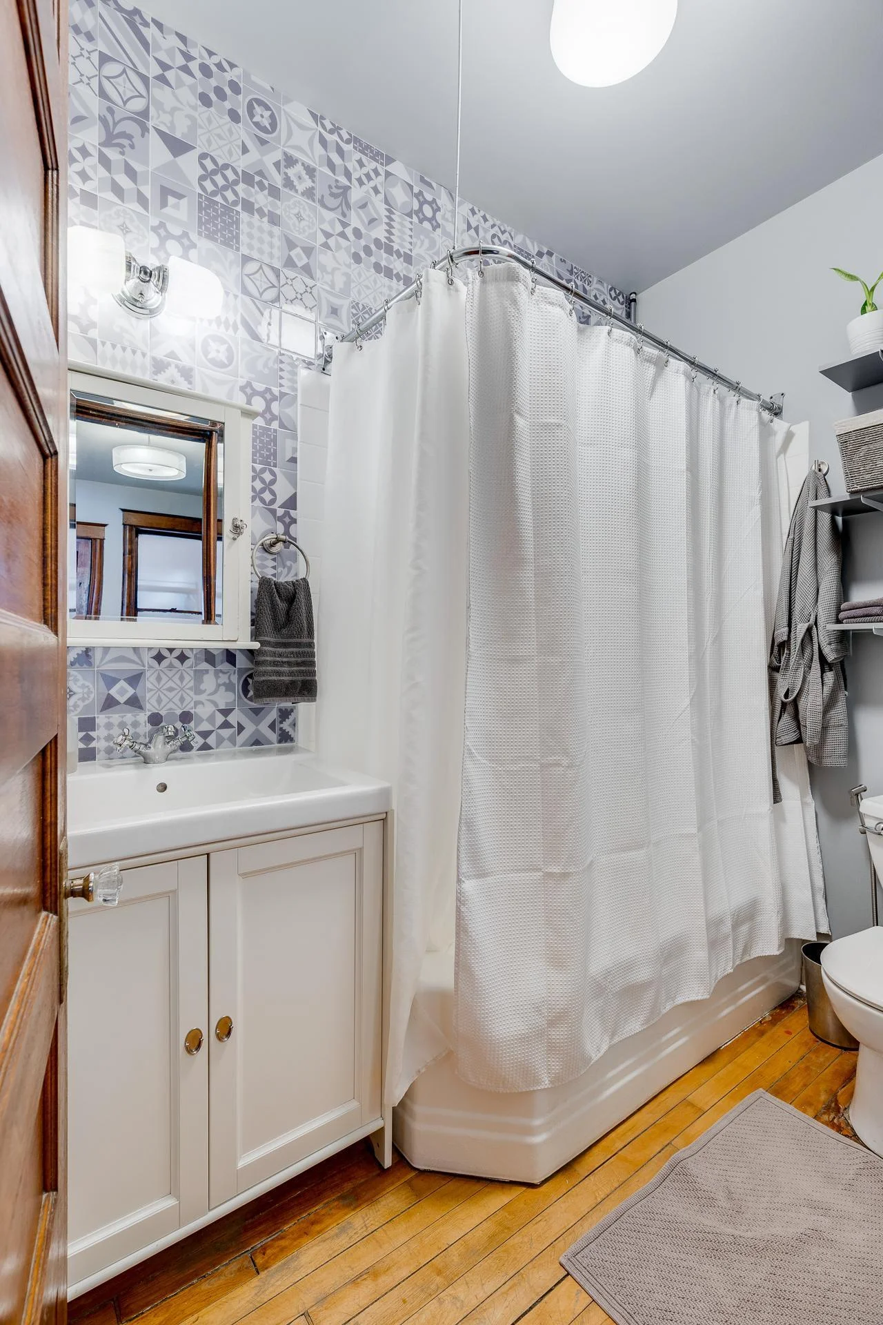 Updated bath with a full tub