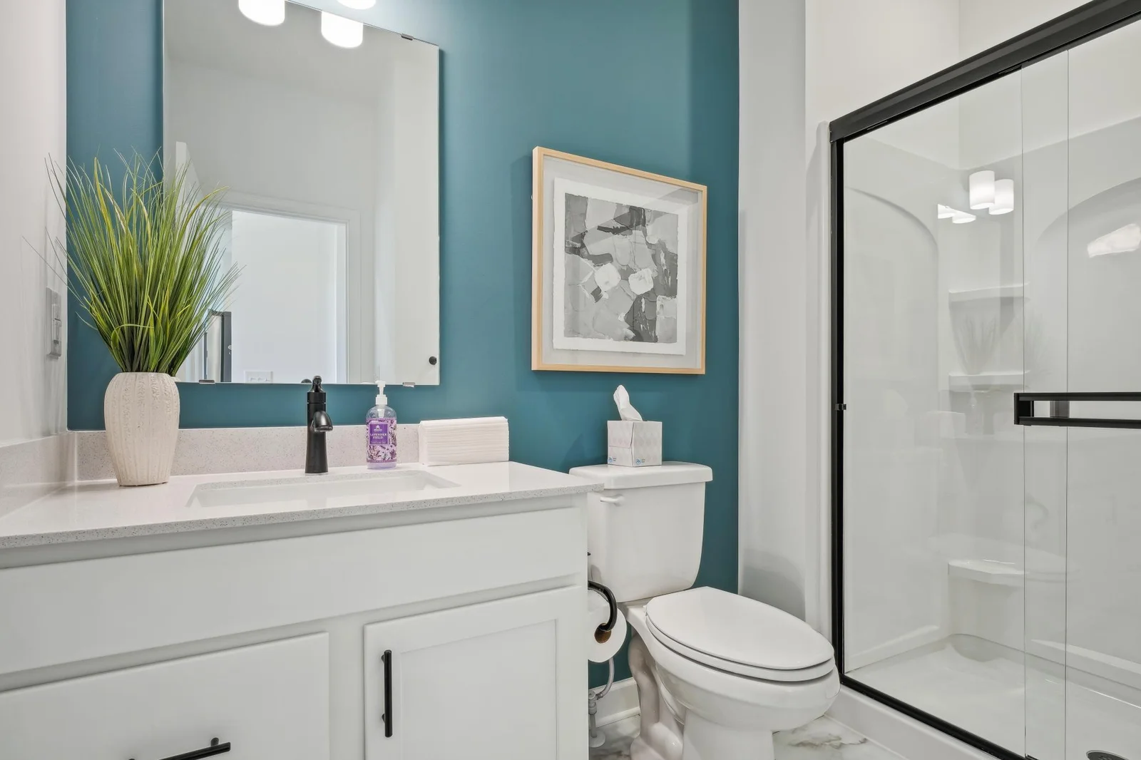 (Photo of a decorated model, actual homes finishes will vary) Main level bath.