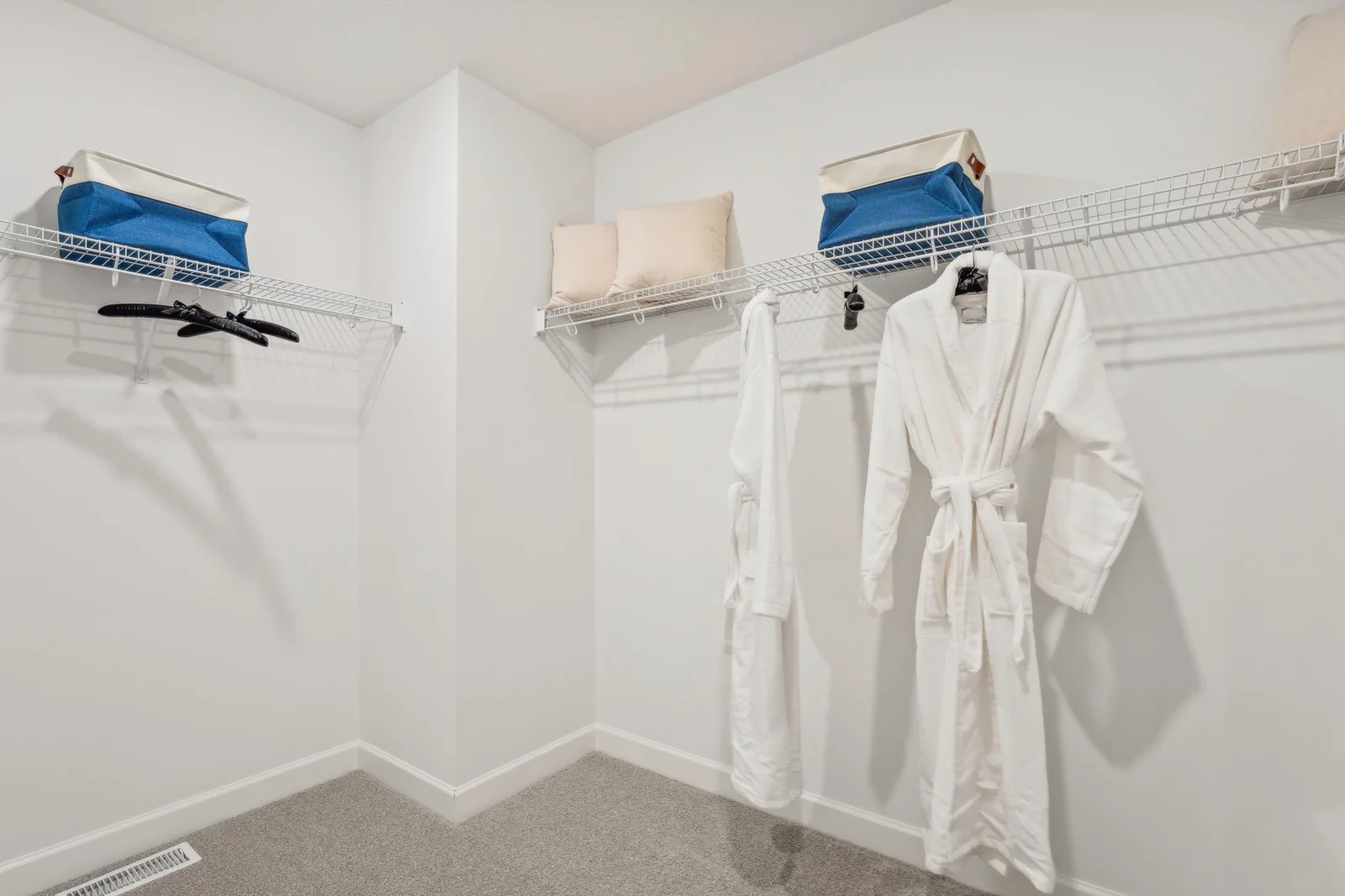 (Photo of a decorated model, actual homes finishes will vary) The stunning walk-in closet.