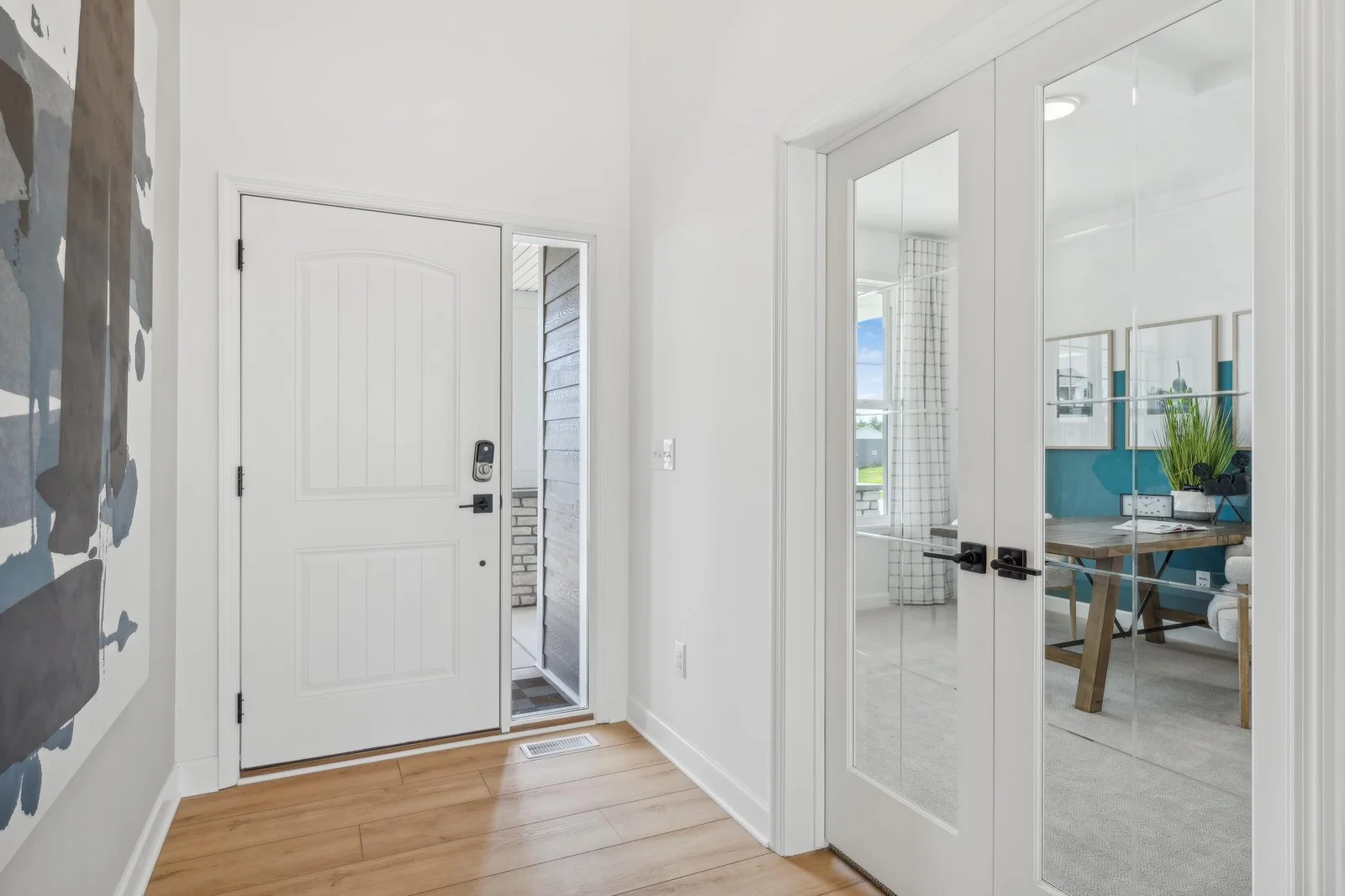 (Photo of a decorated model, actual homes finishes will vary) Make the best first impression with this bright and open foyer.