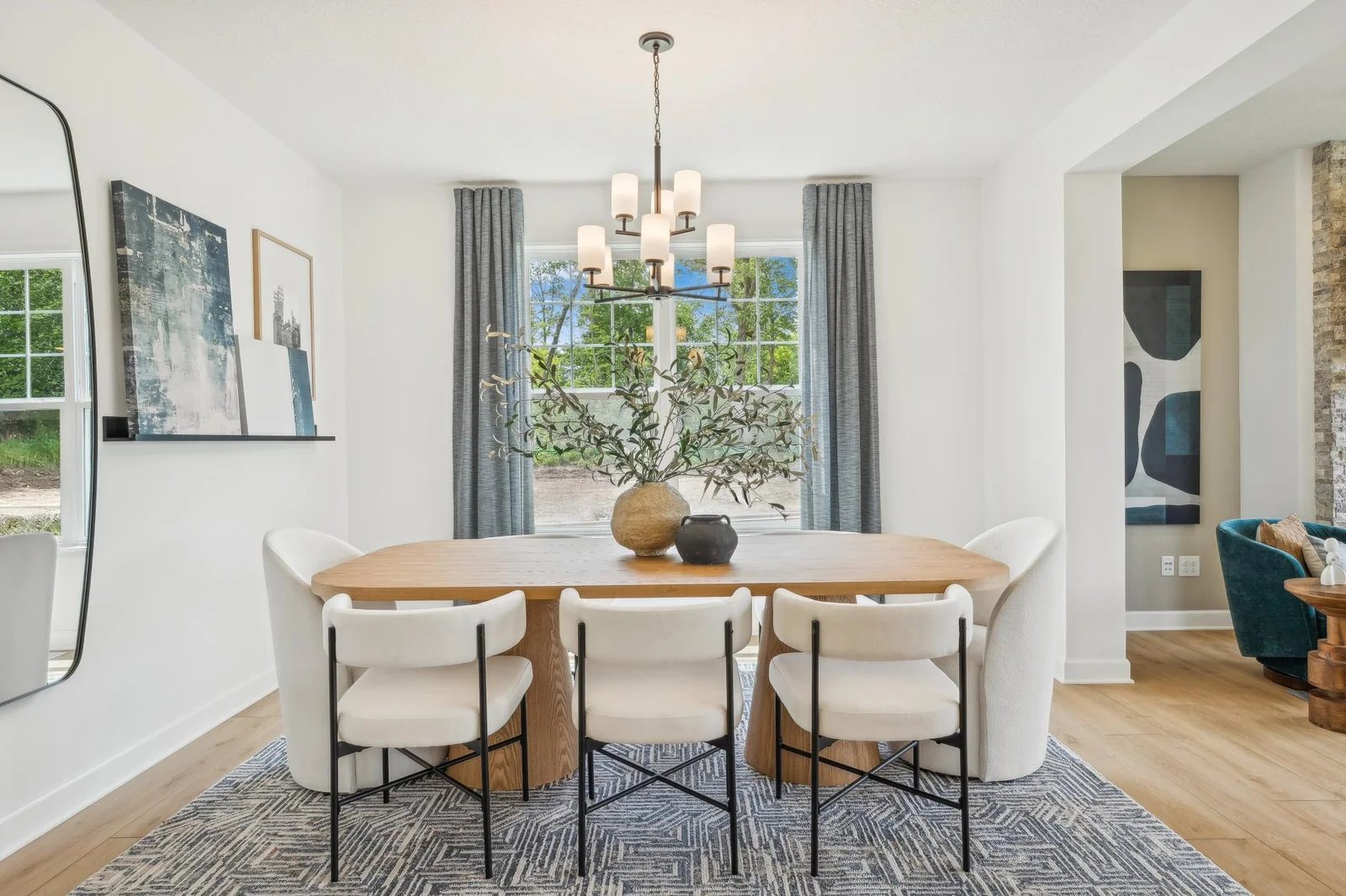 (Photo of a decorated model, actual homes finishes will vary) Formal dining area.
