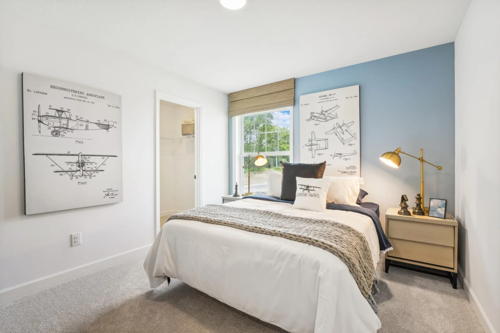 (Photo of a decorated model, actual homes finishes will vary) One of three spacious upper level secondary bedrooms.