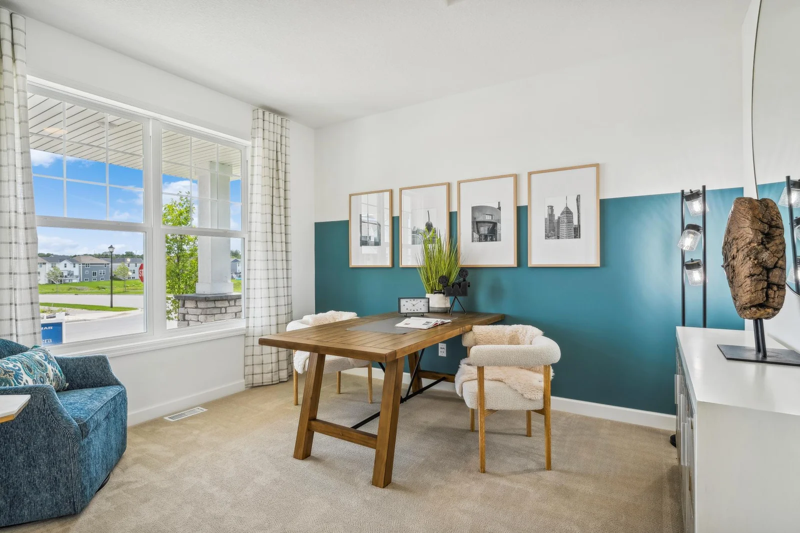 (Photo of a decorated model, actual homes finishes will vary) This main level study provides a perfect setting for those working from home, paying bills or completing a school project.