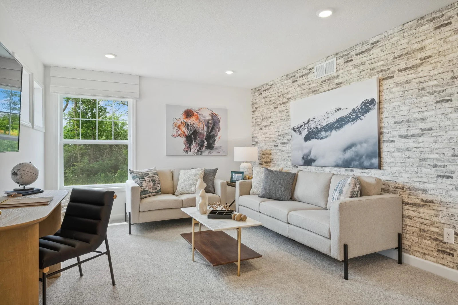 (Photo of a decorated model, actual homes finishes will vary) Located on the upper level, this perfectly sized living space has enough room for a desk, television and seating for all. Plus, it is just steps away from all upper level bedrooms.