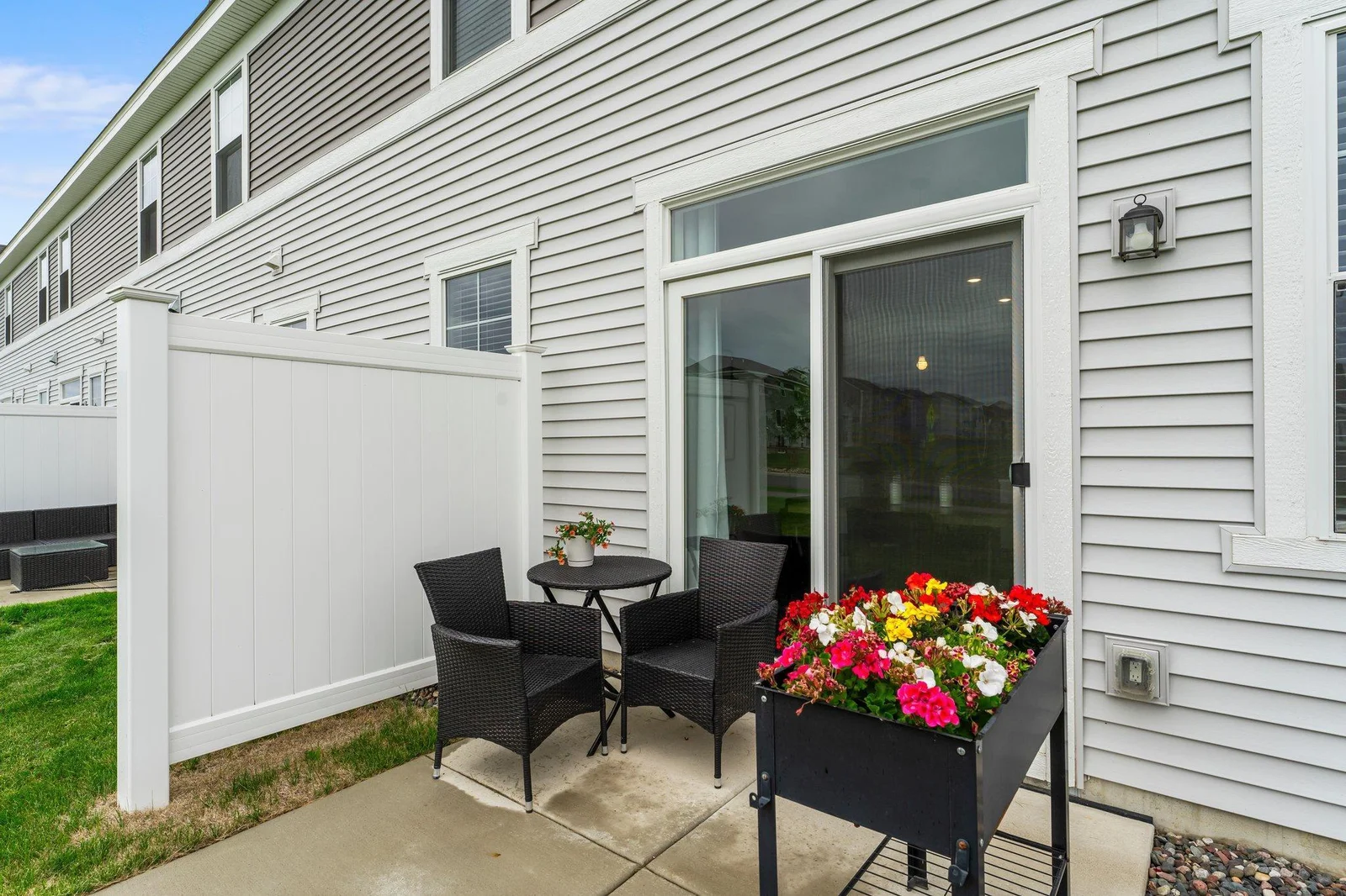 From the dining area, step out onto the 8x8 concrete patio — perfect for morning coffee or summer barbecues.