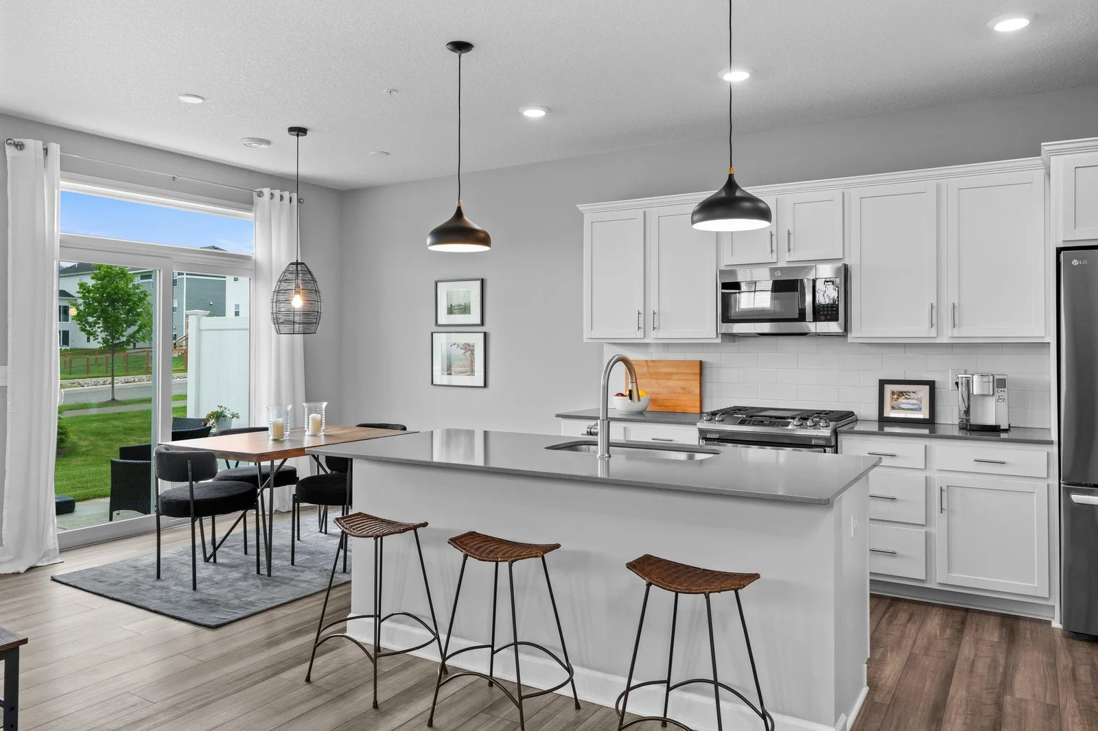 The open-concept main level seamlessly flows into a chef-inspired kitchen that’s truly a dream.