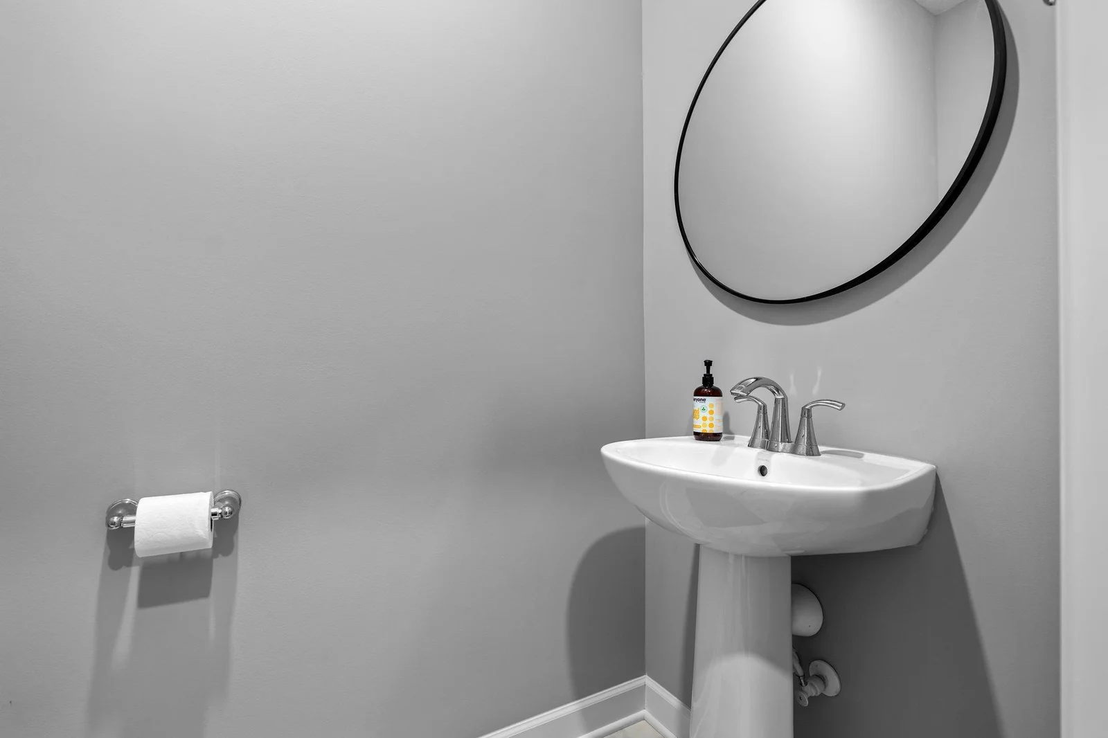 A well-placed main-level half bathroom adds extra convenience.