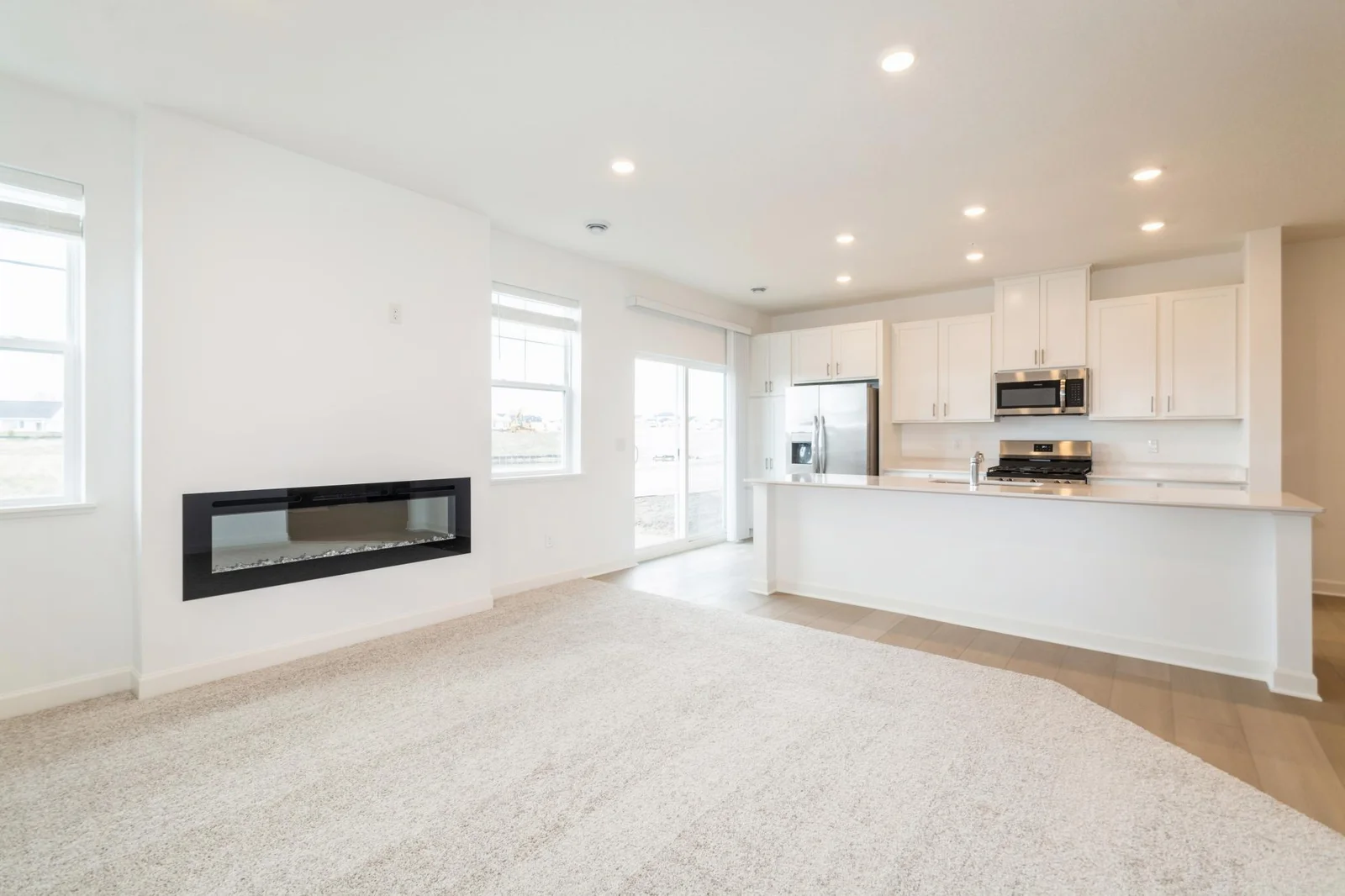 (This is a photo of a similar home!) Notice the stunning natural light pouring into this spacious living room.