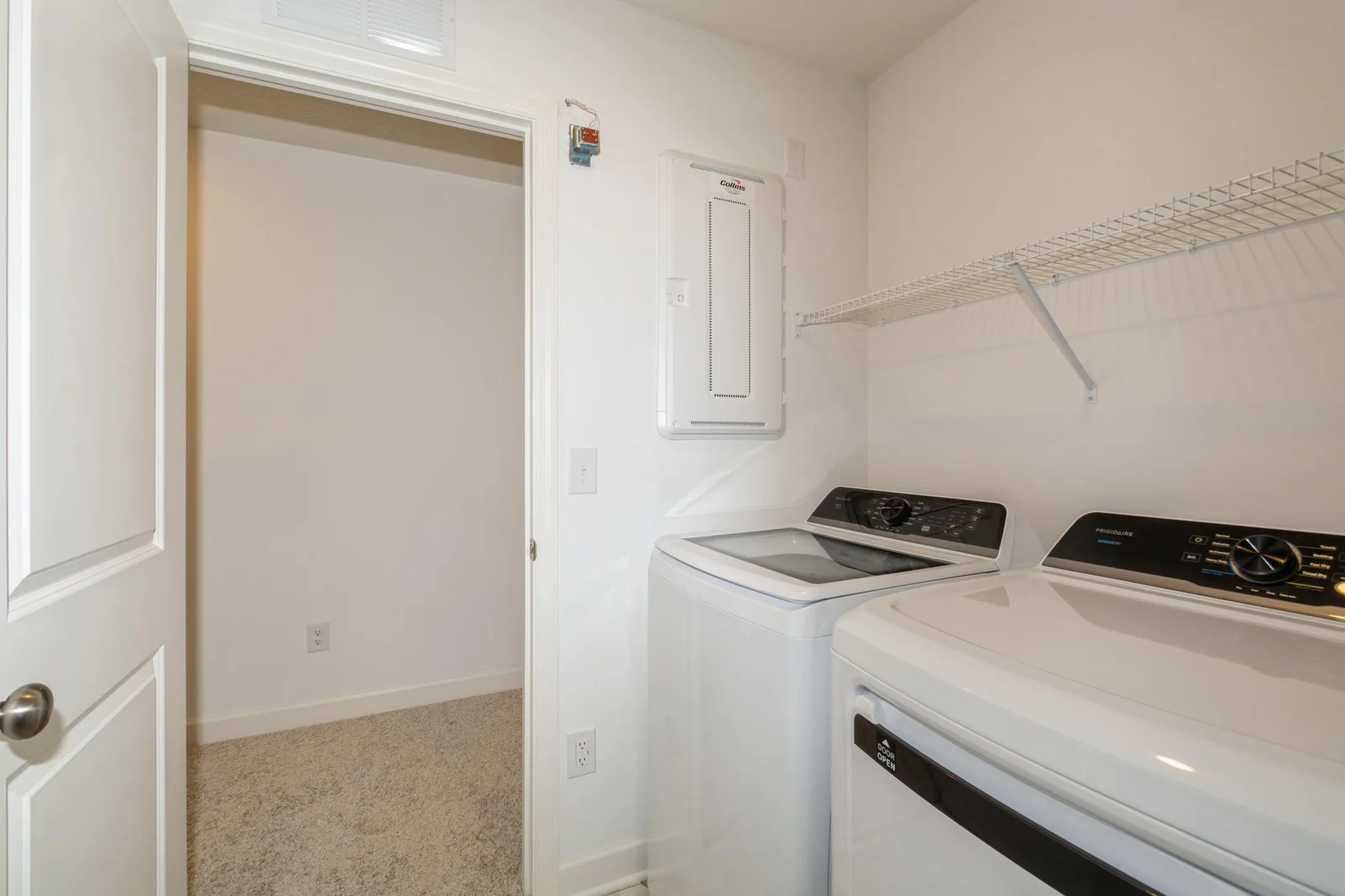(This is a photo of a similar home!) The spacious laundry room!