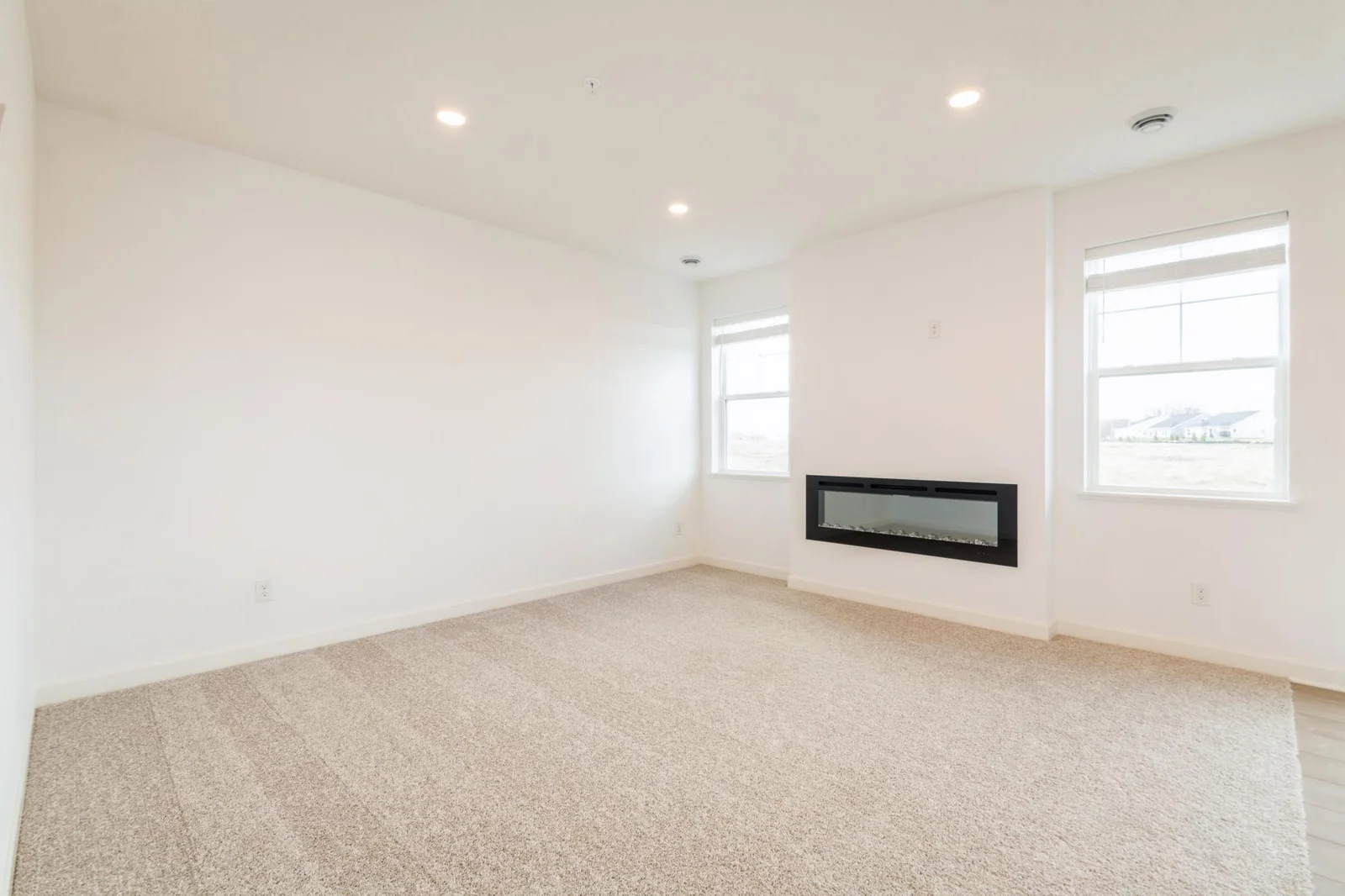 (This is a photo of a similar home!) This home has a cozy fireplace as a stunning focal point in the Living Room!