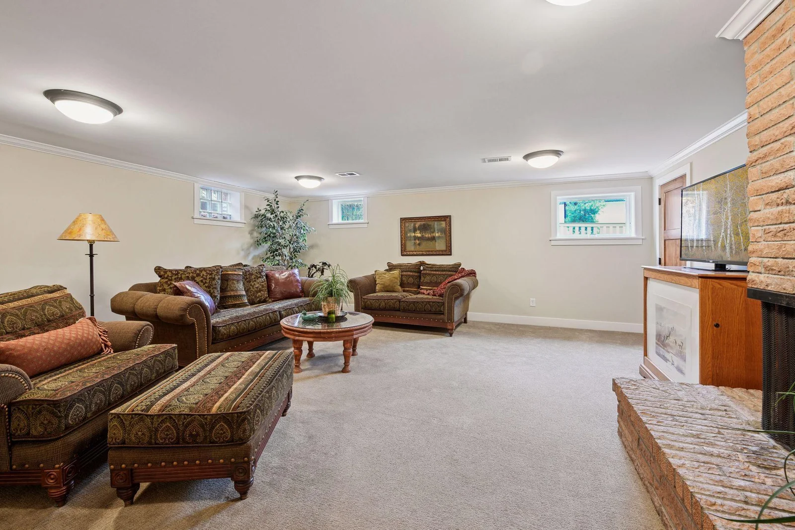 The lower level family room houses the second wood burning fireplace. There is so much room here you could have several different areas that focus on different things like a hobby, fitness, or a play area.