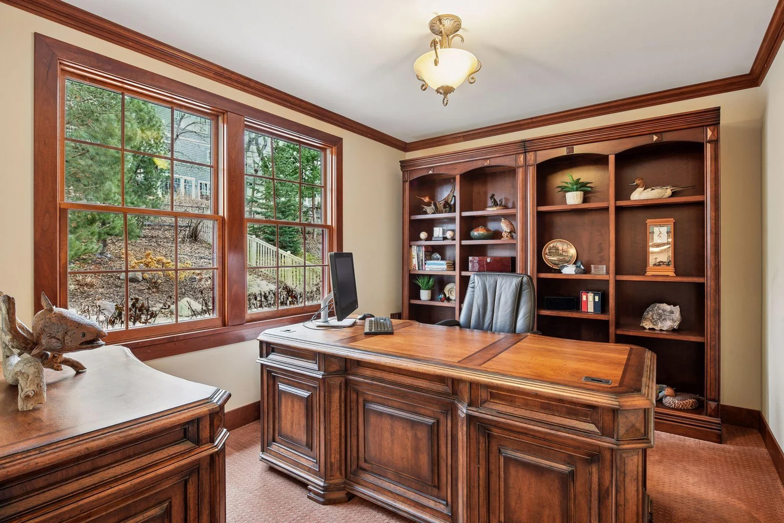 This main floor office/den is just off the family room. The shelves will stay with the house.